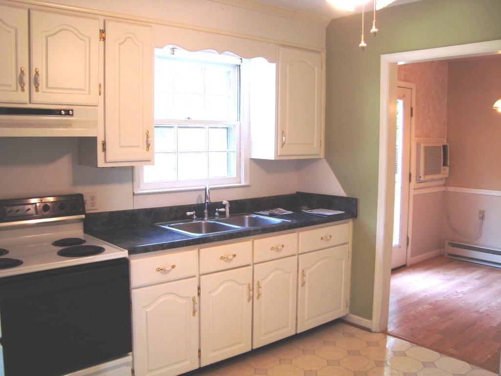 5337 Twilight Road Roanoke, VA 24019 - Photo 3 of 11 a kitchen with granite countertop a sink stainless steel appliances white cabinets and a window