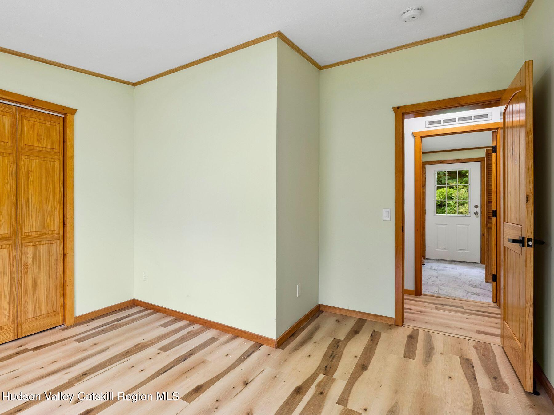 719 Allen Teator Road Durham, NY 12469 - Photo 25 of 38 a view of a room with wooden floor and a bathroom