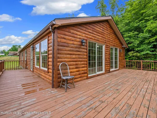 a balcony view with a seating space