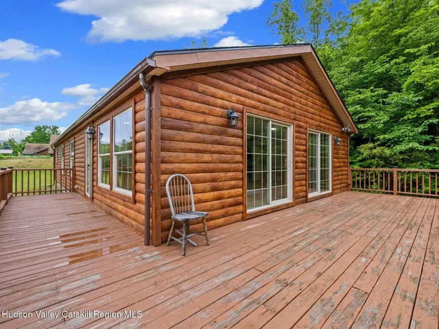 a balcony view with a seating space