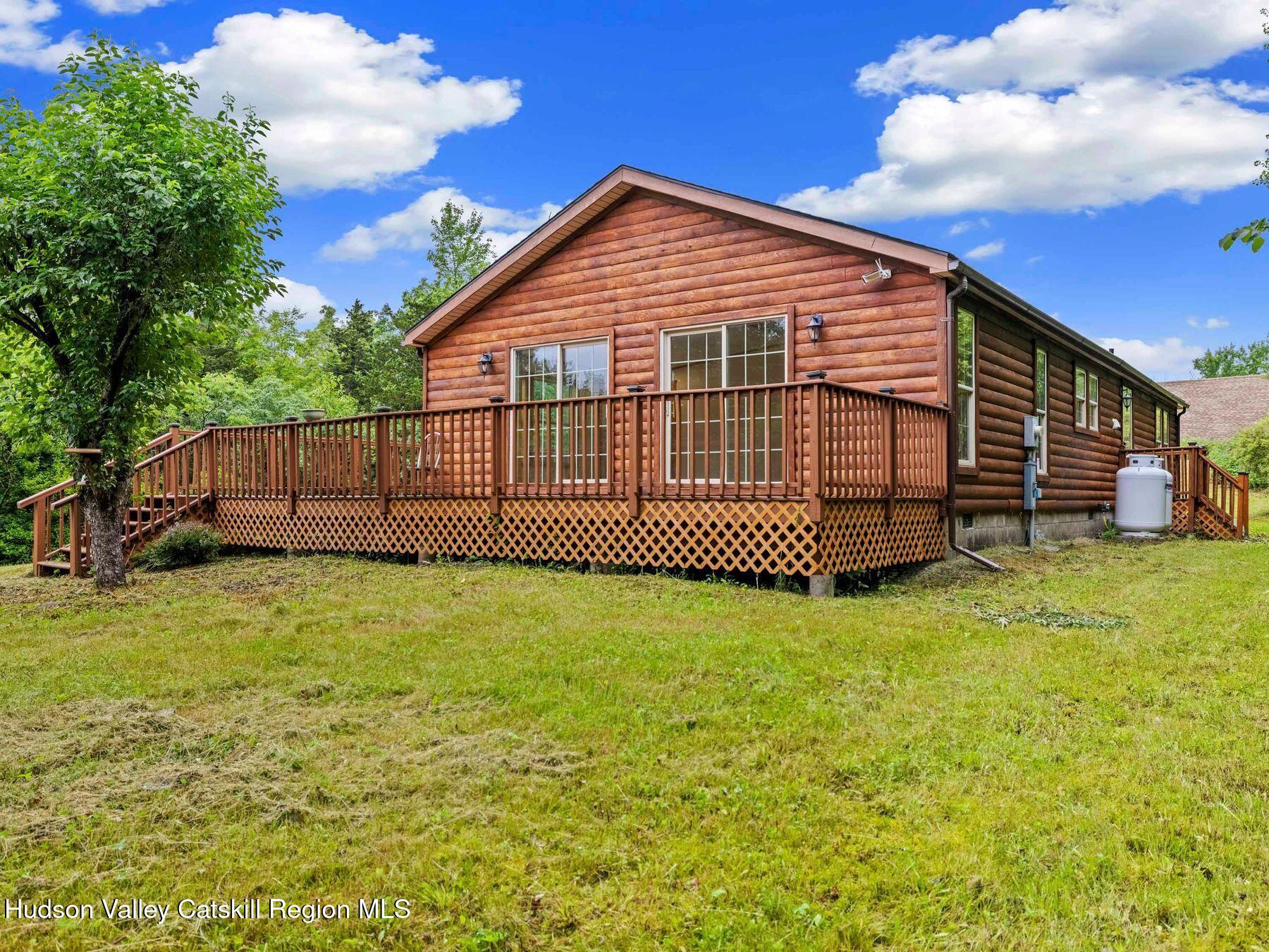719 Allen Teator Road Durham, NY 12469 - Photo 32 of 38 a front view of a house with a yard