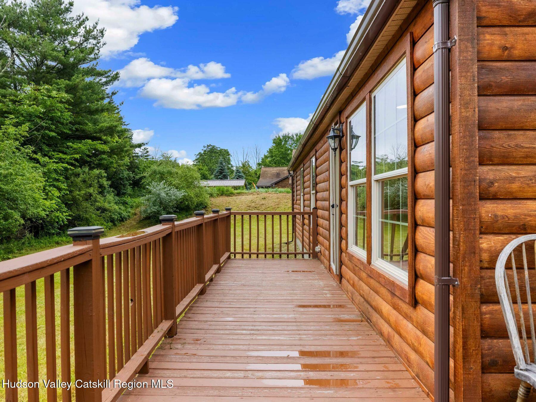719 Allen Teator Road Durham, NY 12469 - Photo 34 of 38 a view of a balcony with wooden stairs