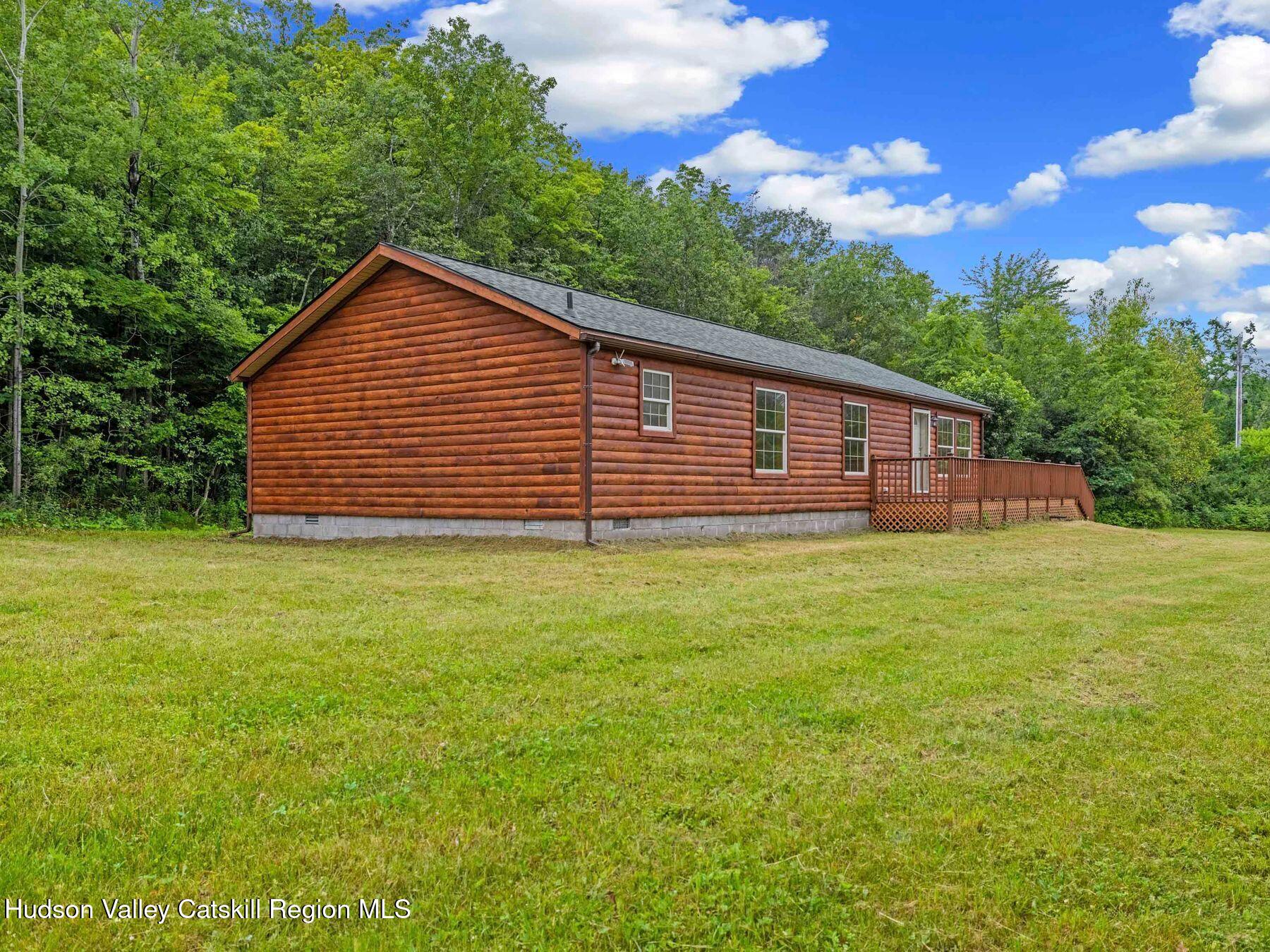 719 Allen Teator Road Durham, NY 12469 - Photo 35 of 38 a view of a house with a backyard