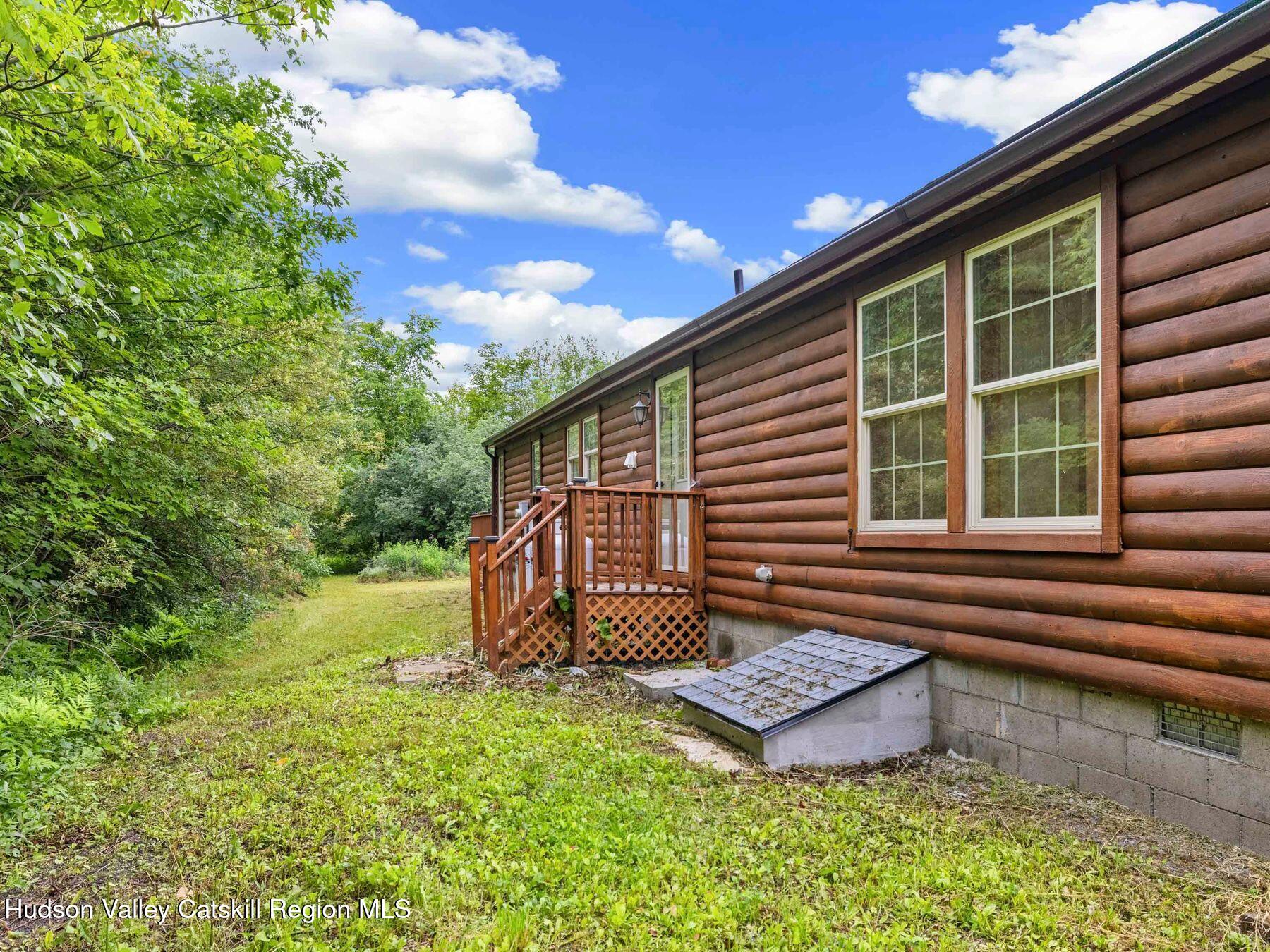719 Allen Teator Road Durham, NY 12469 - Photo 37 of 38 a front view of a house with garden