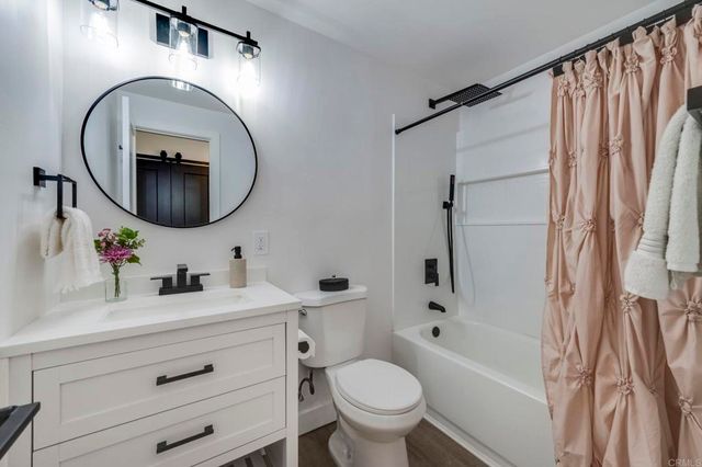 a bathroom with a sink a bathtub and a toilet
