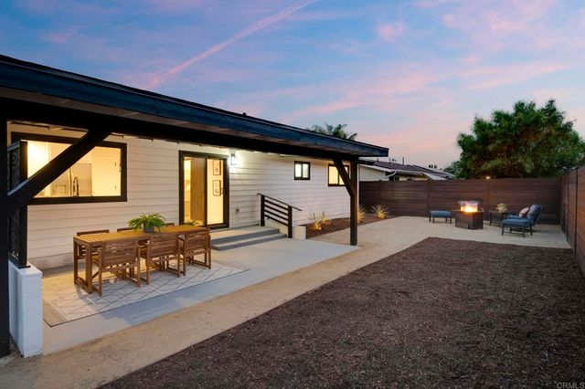 a swimming pool with outdoor seating