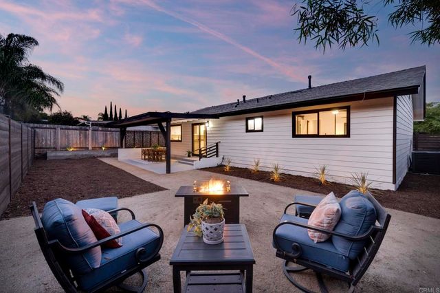 a outdoor living space with furniture and a potted plant
