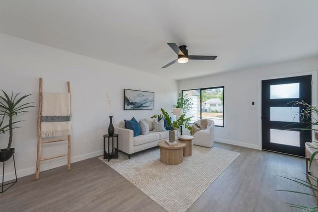 a living room with furniture and window