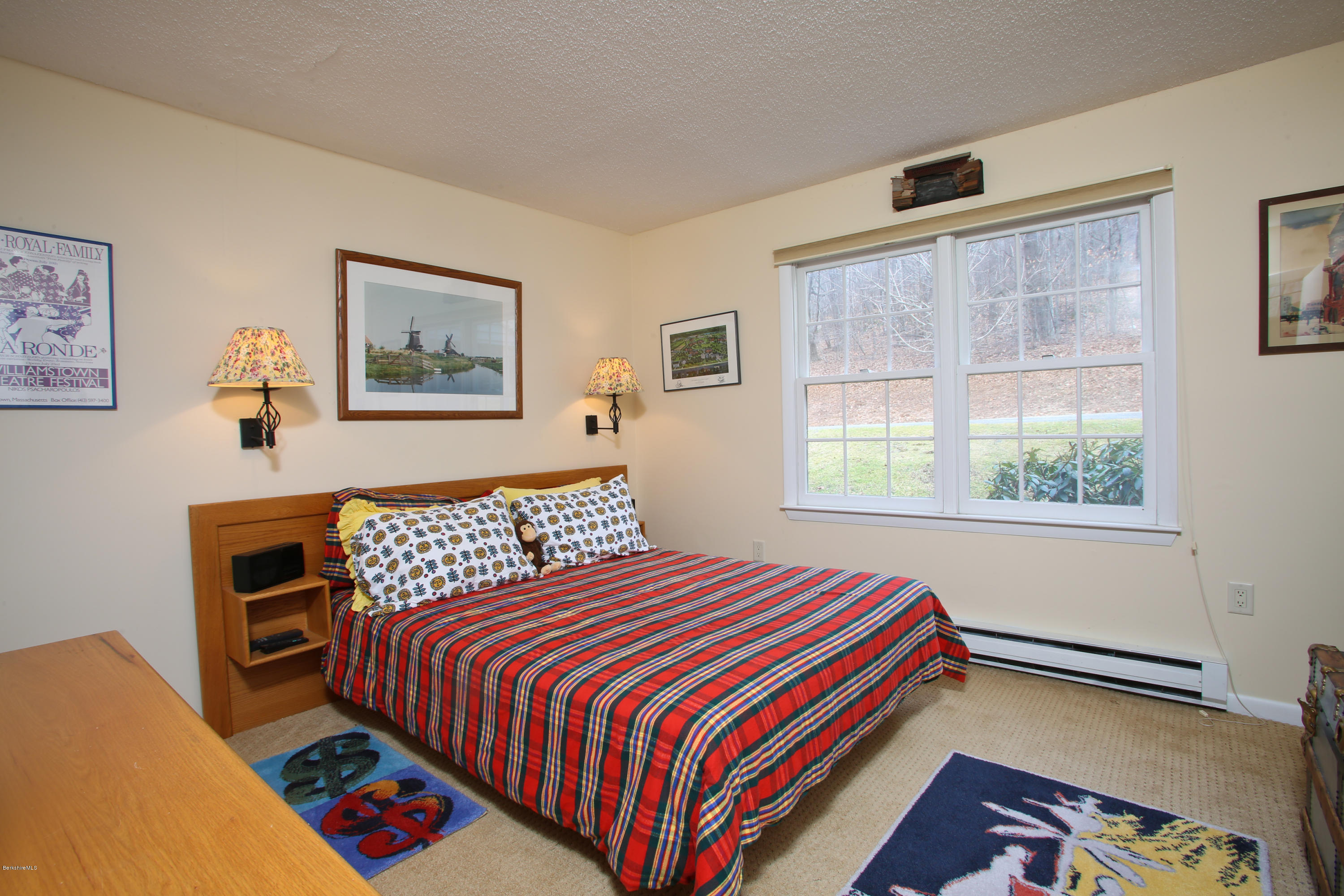 1041-104 Beaver Pond Road, Unit A Hancock, MA 01237 - Photo 2 of 13 a bedroom with a bed and a window