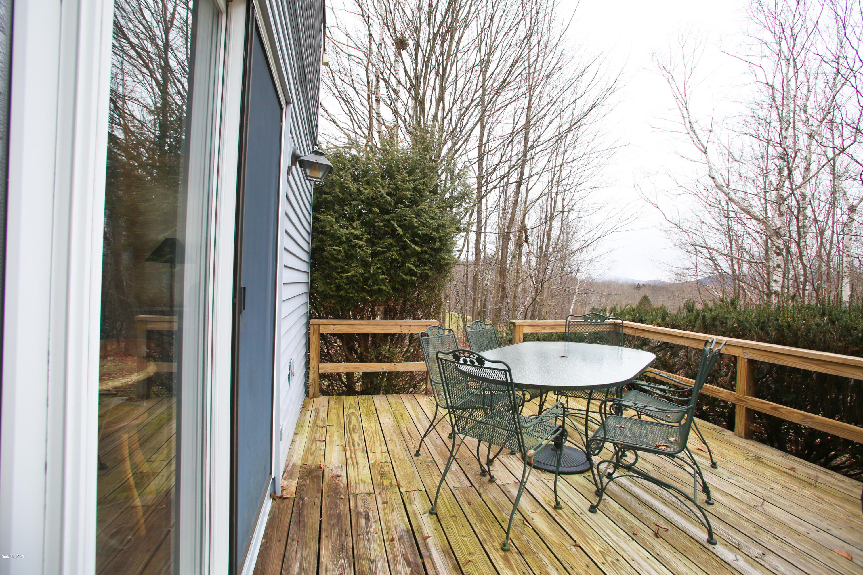 1041-104 Beaver Pond Road, Unit A Hancock, MA 01237 - Photo 12 of 13 a balcony with table and chairs