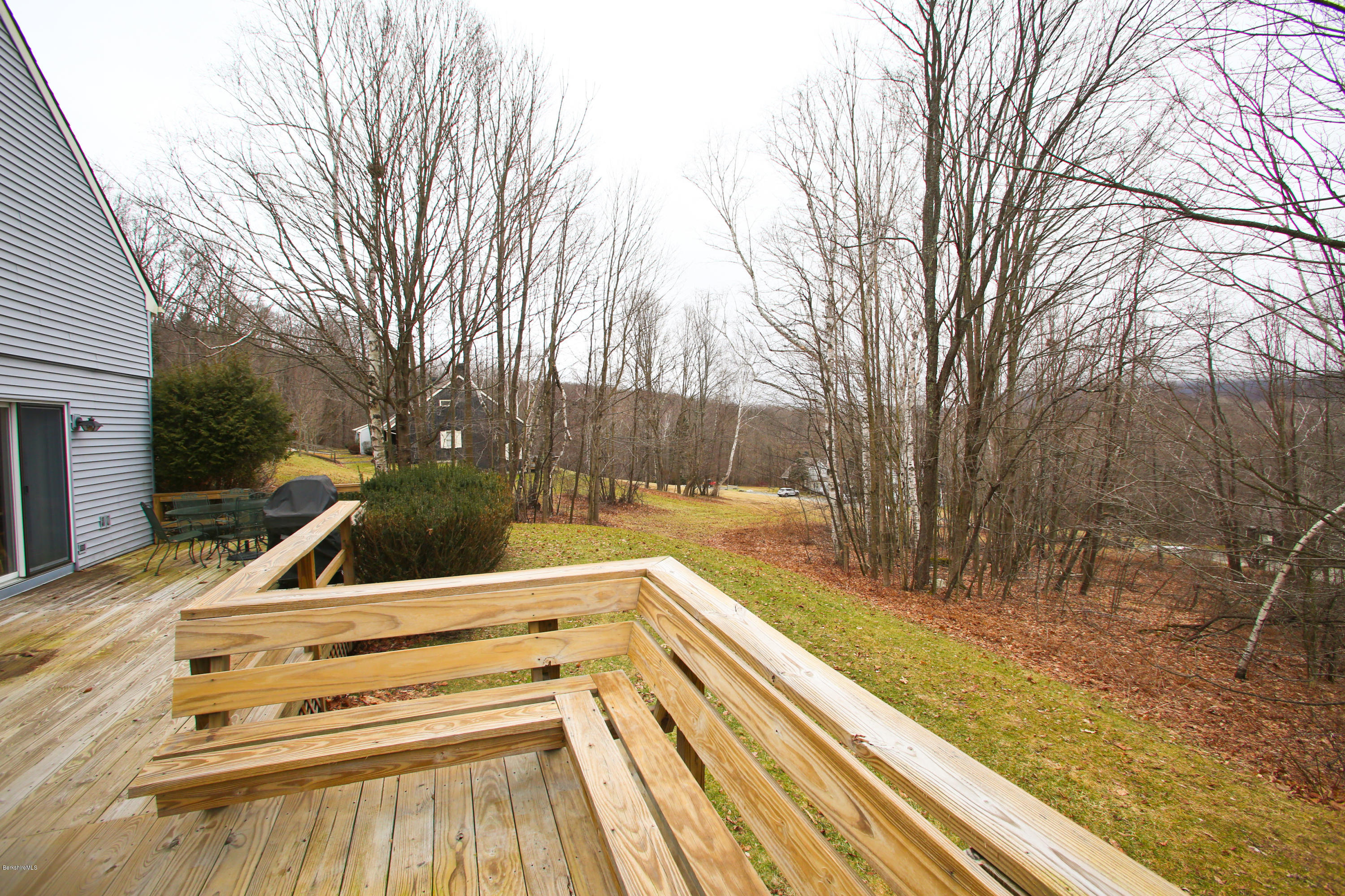 1041-104 Beaver Pond Road, Unit A Hancock, MA 01237 - Photo 13 of 13 a view of backyard with trees