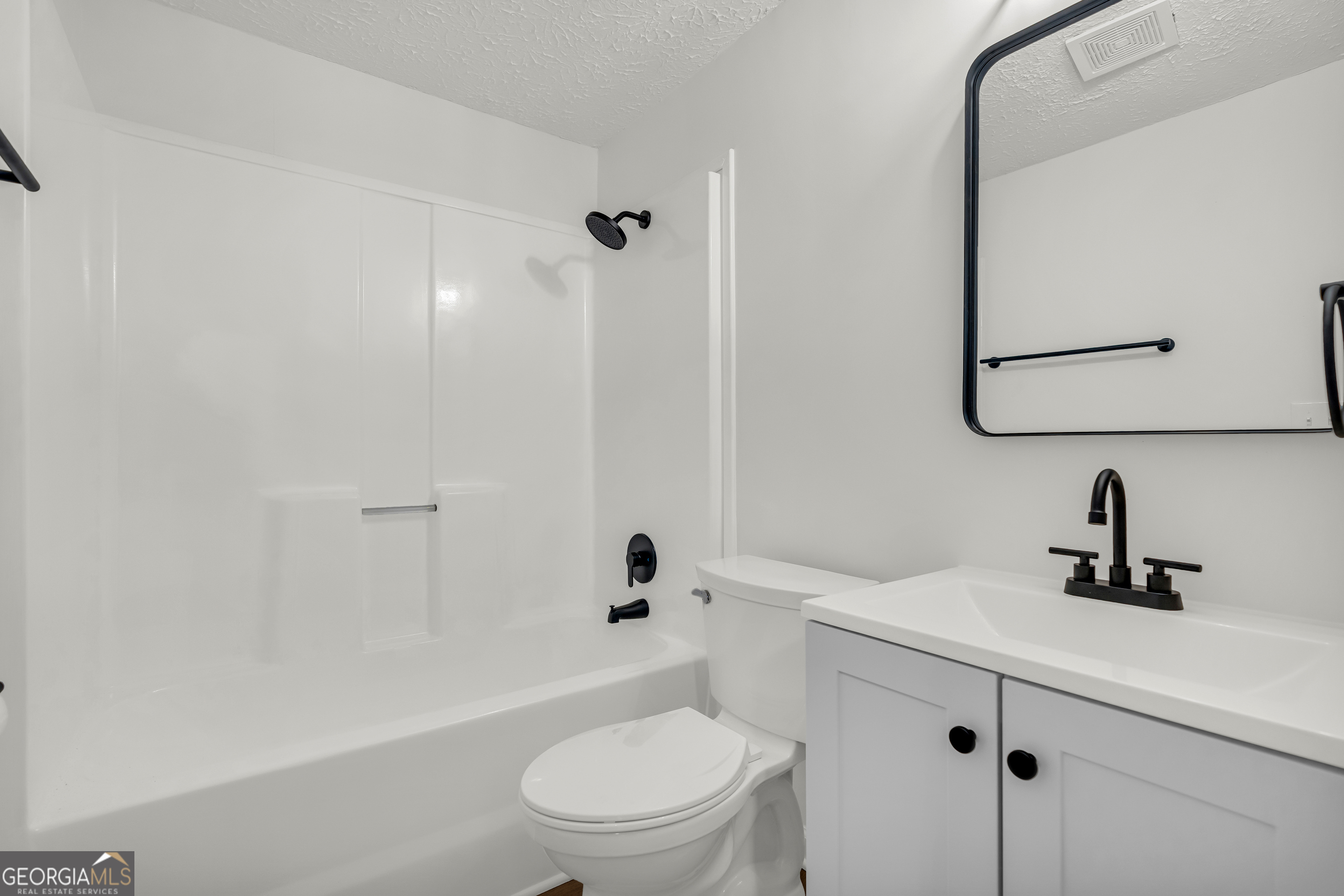 395 Barnetts Bridge Road Jackson, GA 30233 - Photo 15 of 82 a bathroom with a sink a toilet and shower