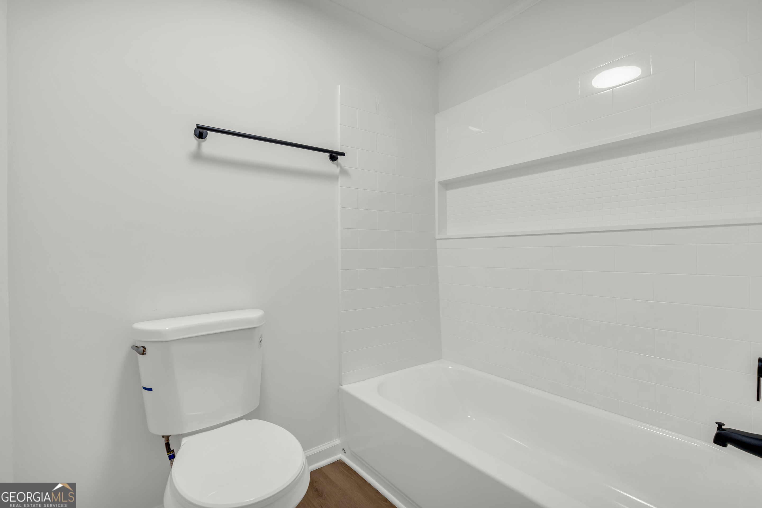 395 Barnetts Bridge Road Jackson, GA 30233 - Photo 21 of 82 a white toilet sitting next to a bath tub