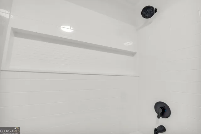 a kitchen with granite countertop a sink stove and refrigerator