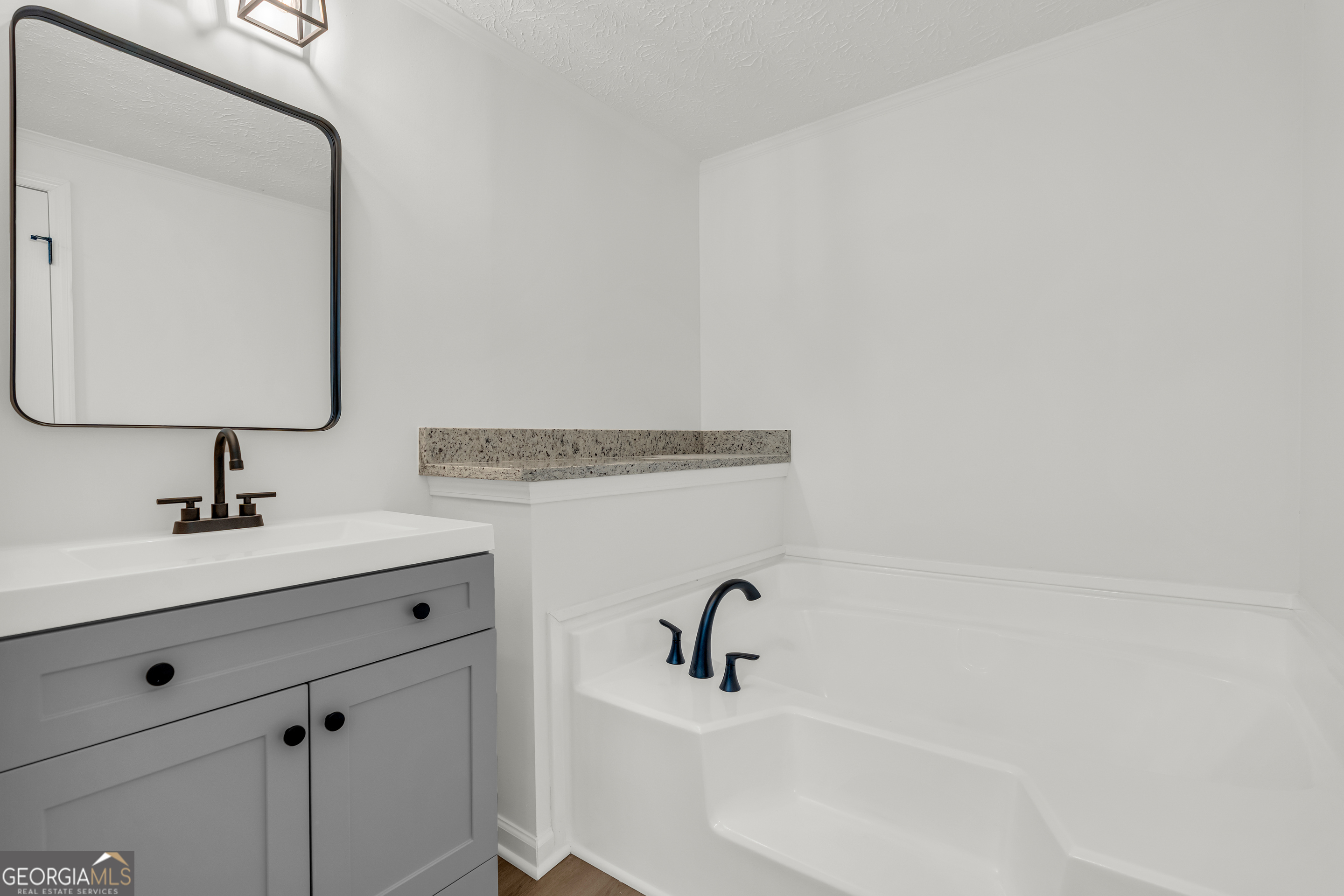 395 Barnetts Bridge Road Jackson, GA 30233 - Photo 23 of 82 a bathroom with a sink and a mirror