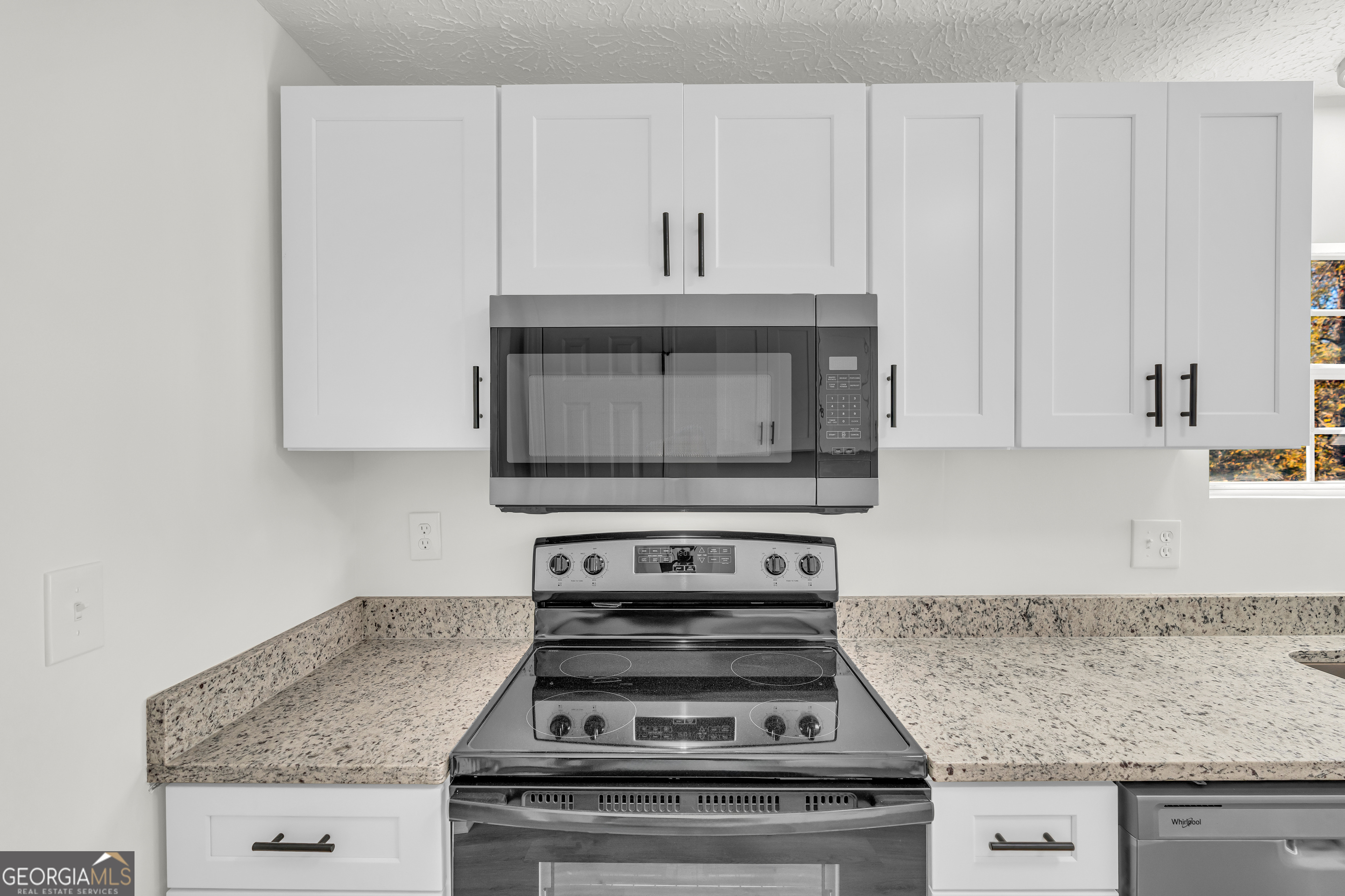 395 Barnetts Bridge Road Jackson, GA 30233 - Photo 30 of 82 a stove top oven sitting inside of a kitchen