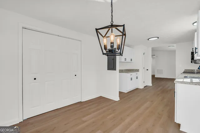 a balcony with wooden floor and windows