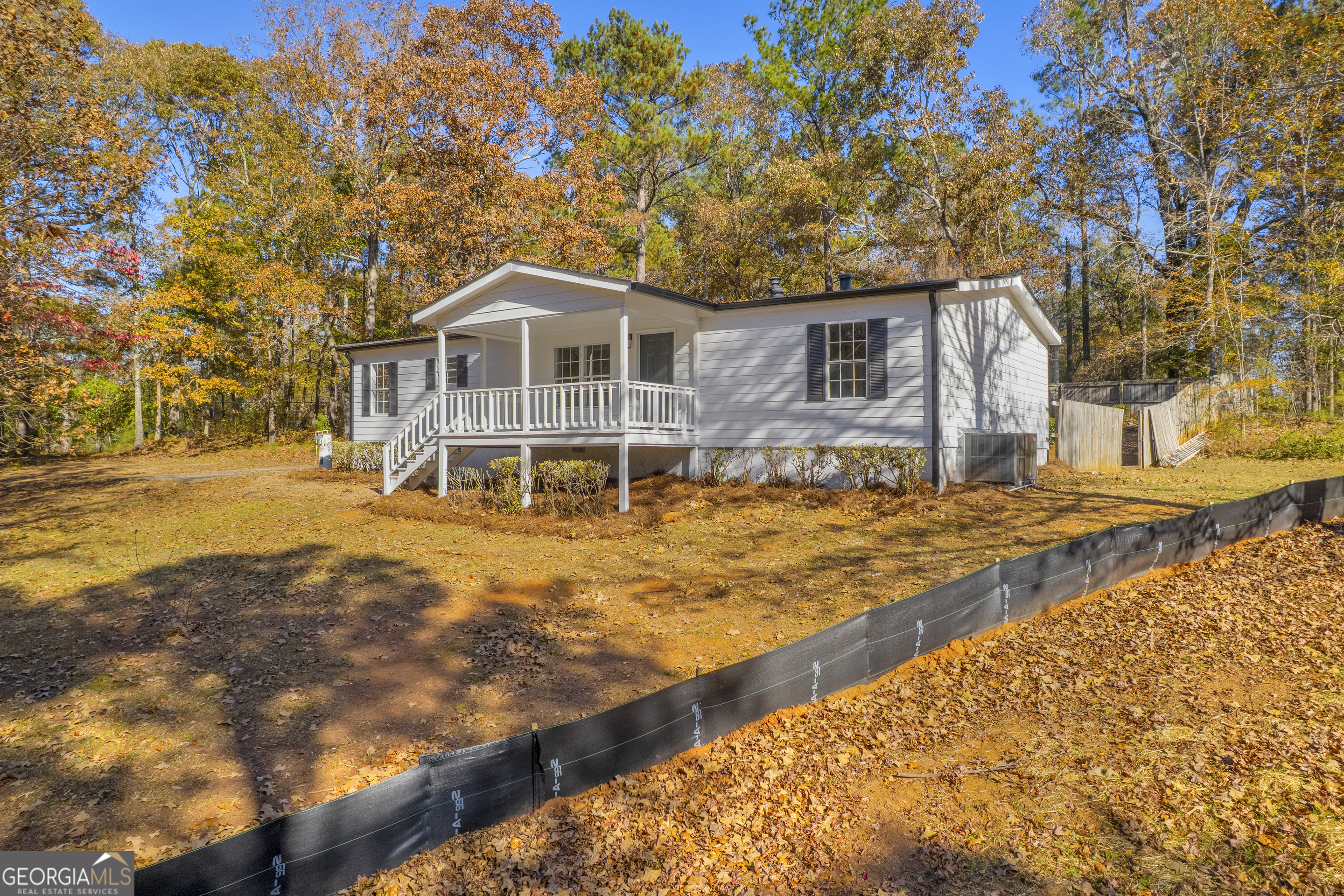395 Barnetts Bridge Road Jackson, GA 30233 - Photo 38 of 82 a front view of a house with a yard