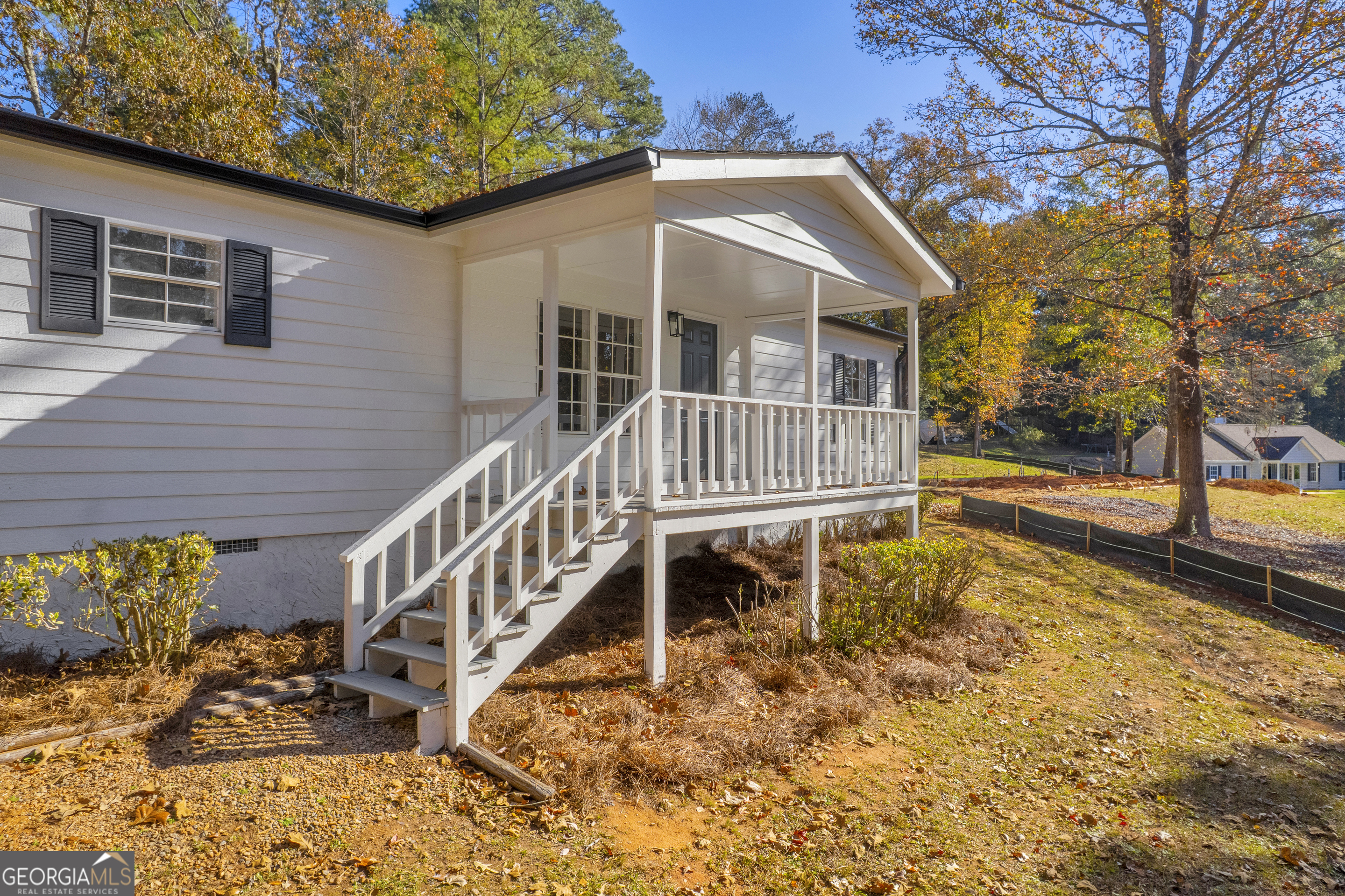 395 Barnetts Bridge Road Jackson, GA 30233 - Photo 39 of 82 a view of a house with backyard and sitting area