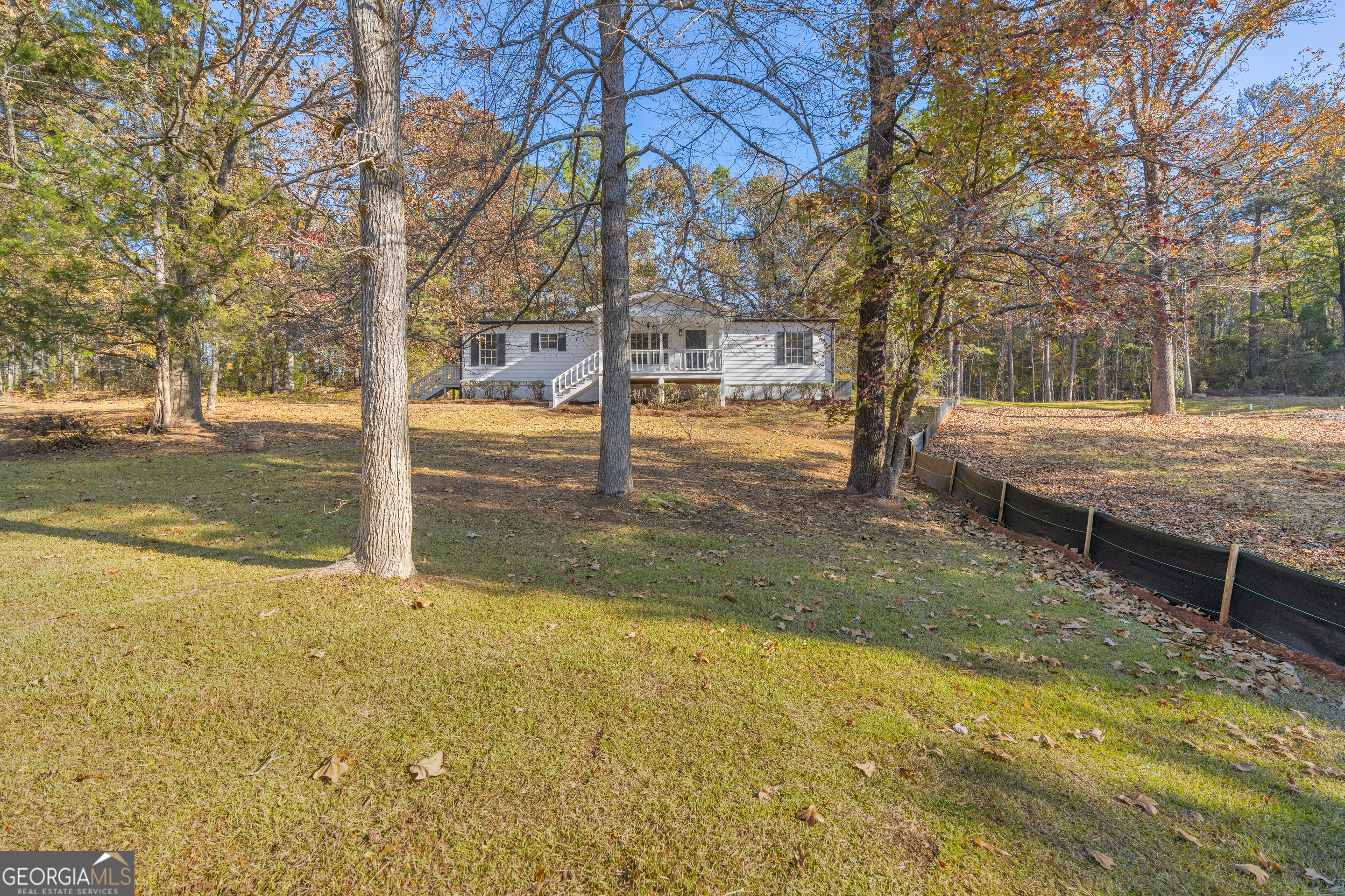 395 Barnetts Bridge Road Jackson, GA 30233 - Photo 42 of 82 a view of a yard with swimming pool