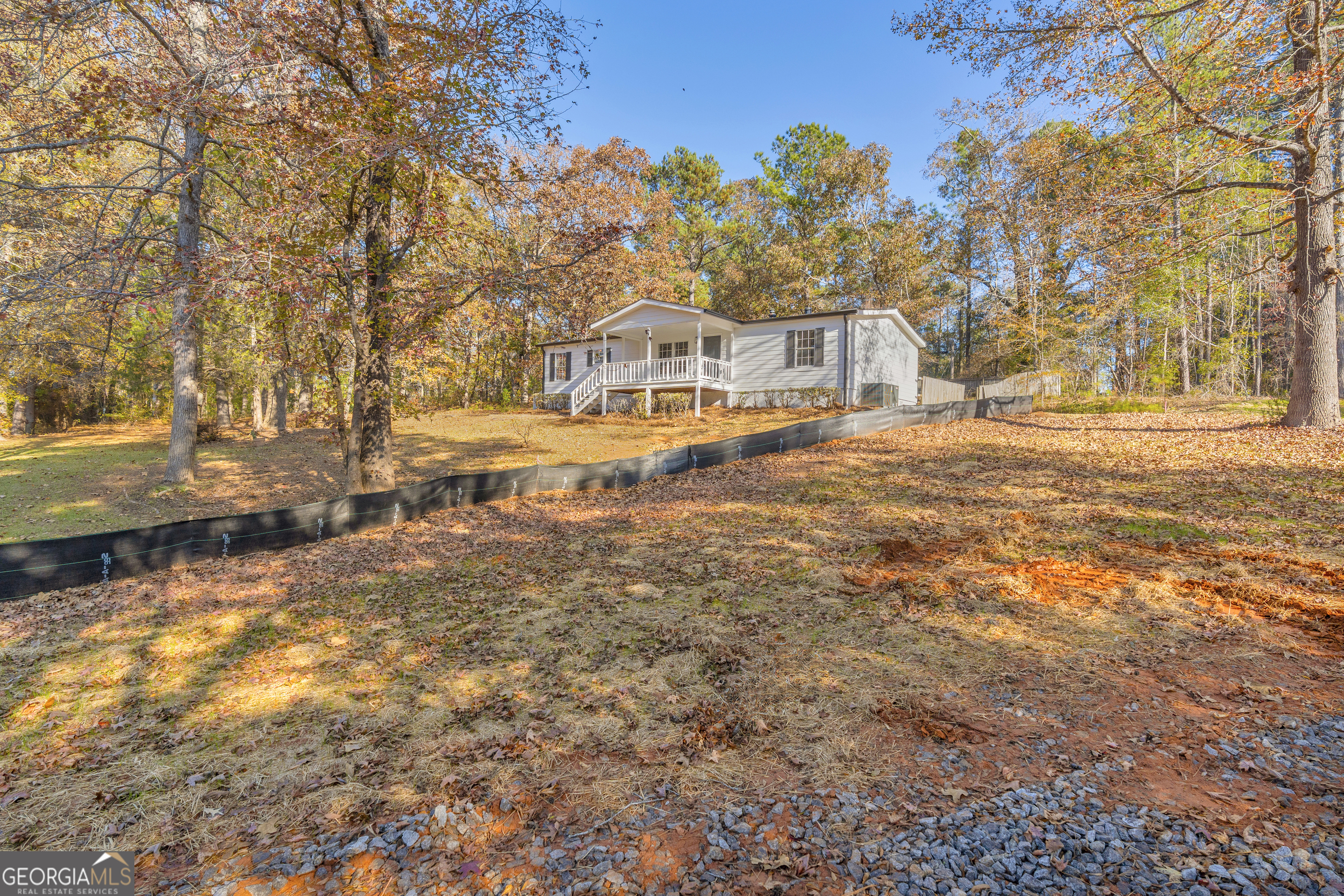 395 Barnetts Bridge Road Jackson, GA 30233 - Photo 43 of 82 a front view of a house with a yard