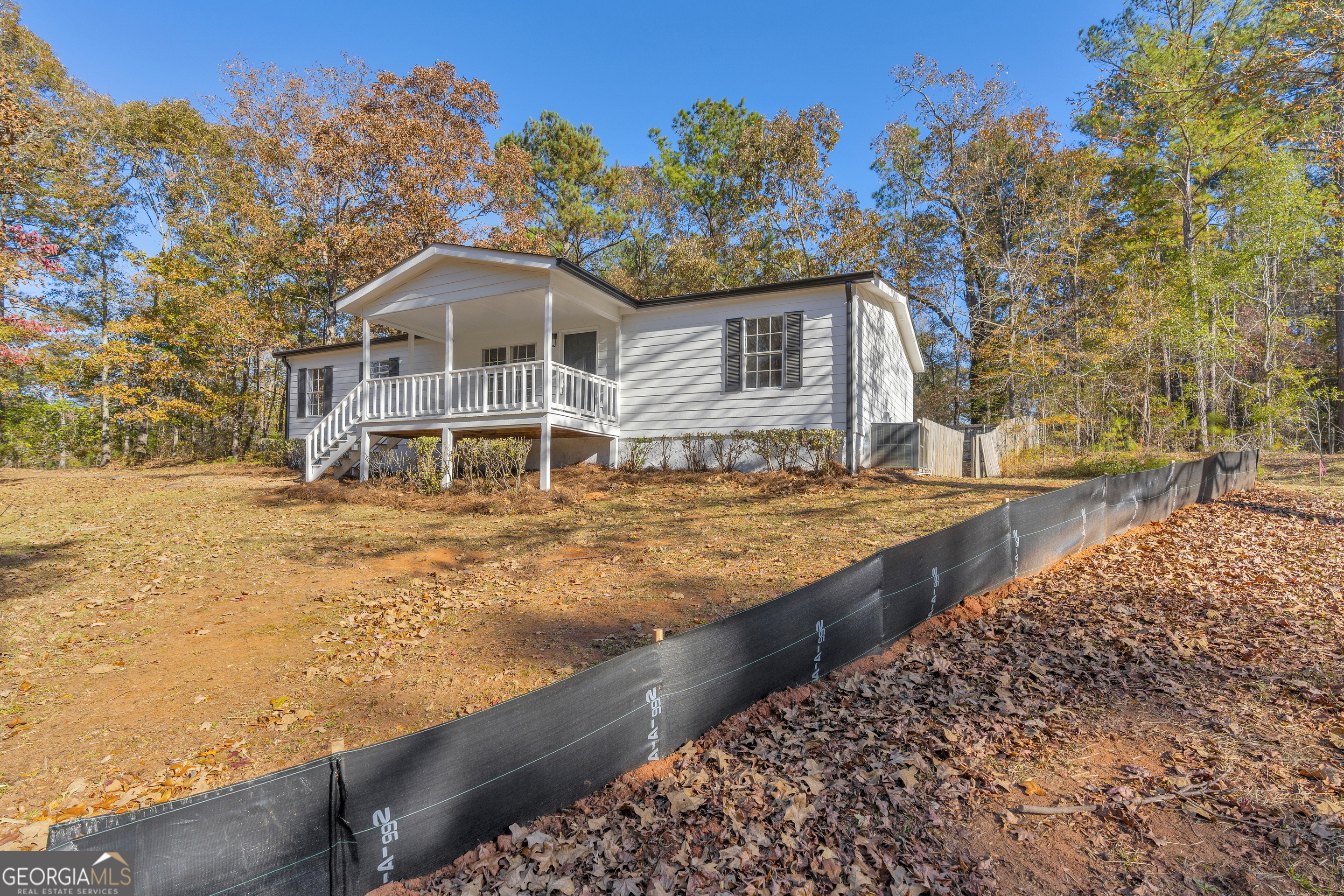 395 Barnetts Bridge Road Jackson, GA 30233 - Photo 46 of 82 a front view of a house with a yard