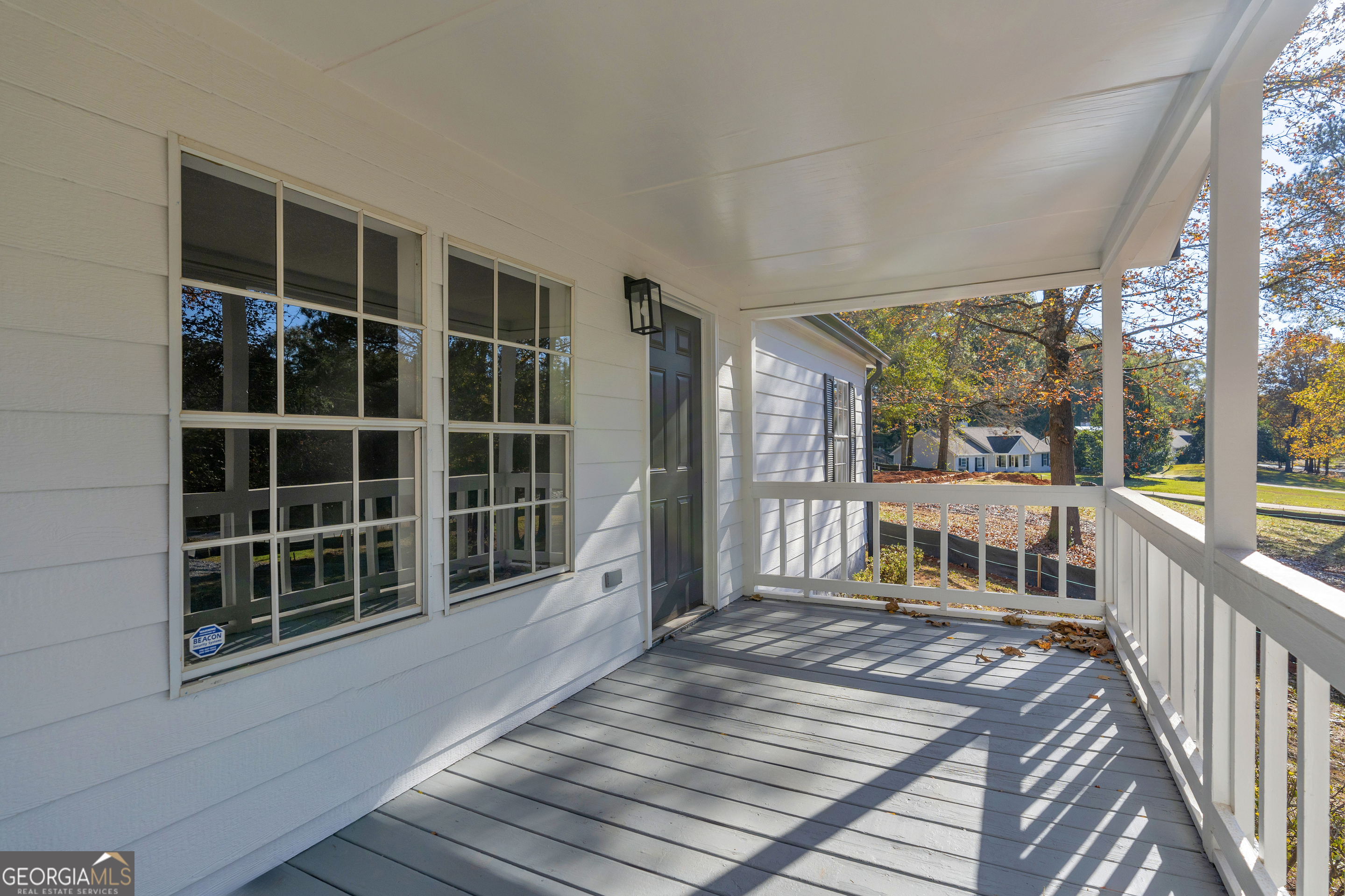 395 Barnetts Bridge Road Jackson, GA 30233 - Photo 49 of 82 a balcony with wooden floor and windows