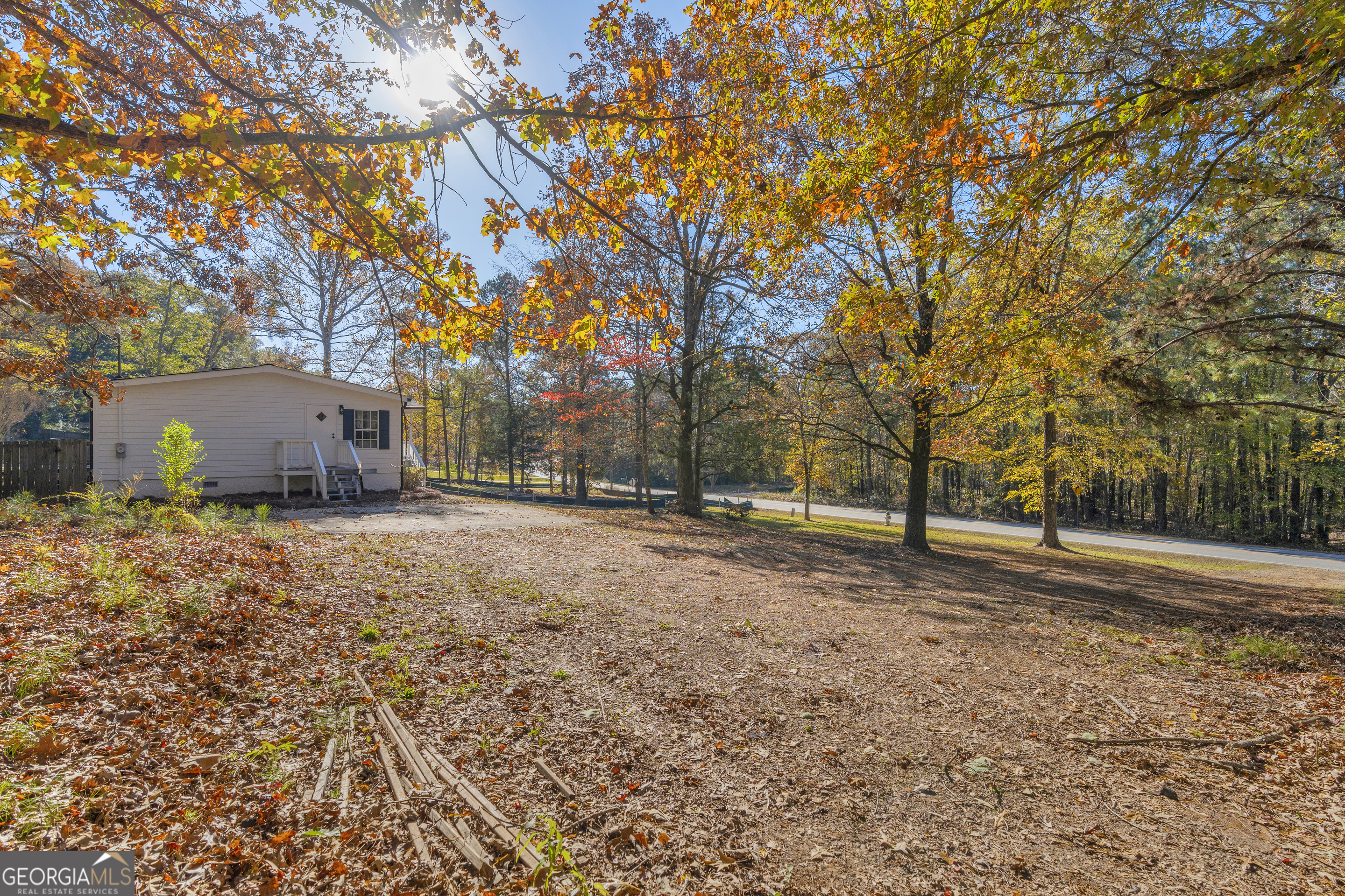 395 Barnetts Bridge Road Jackson, GA 30233 - Photo 51 of 82 a backyard of a house with lots of green space