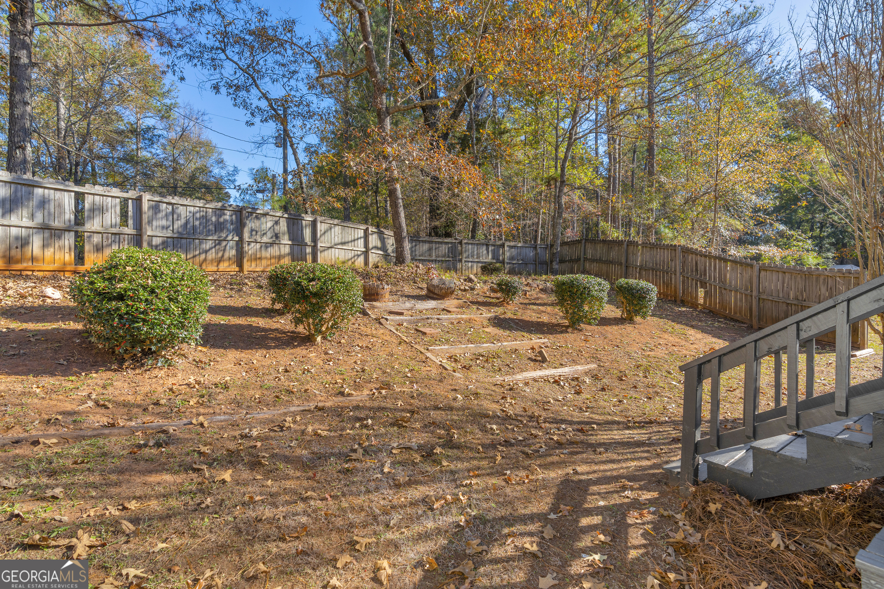 395 Barnetts Bridge Road Jackson, GA 30233 - Photo 58 of 82 a backyard of a house with table and chairs
