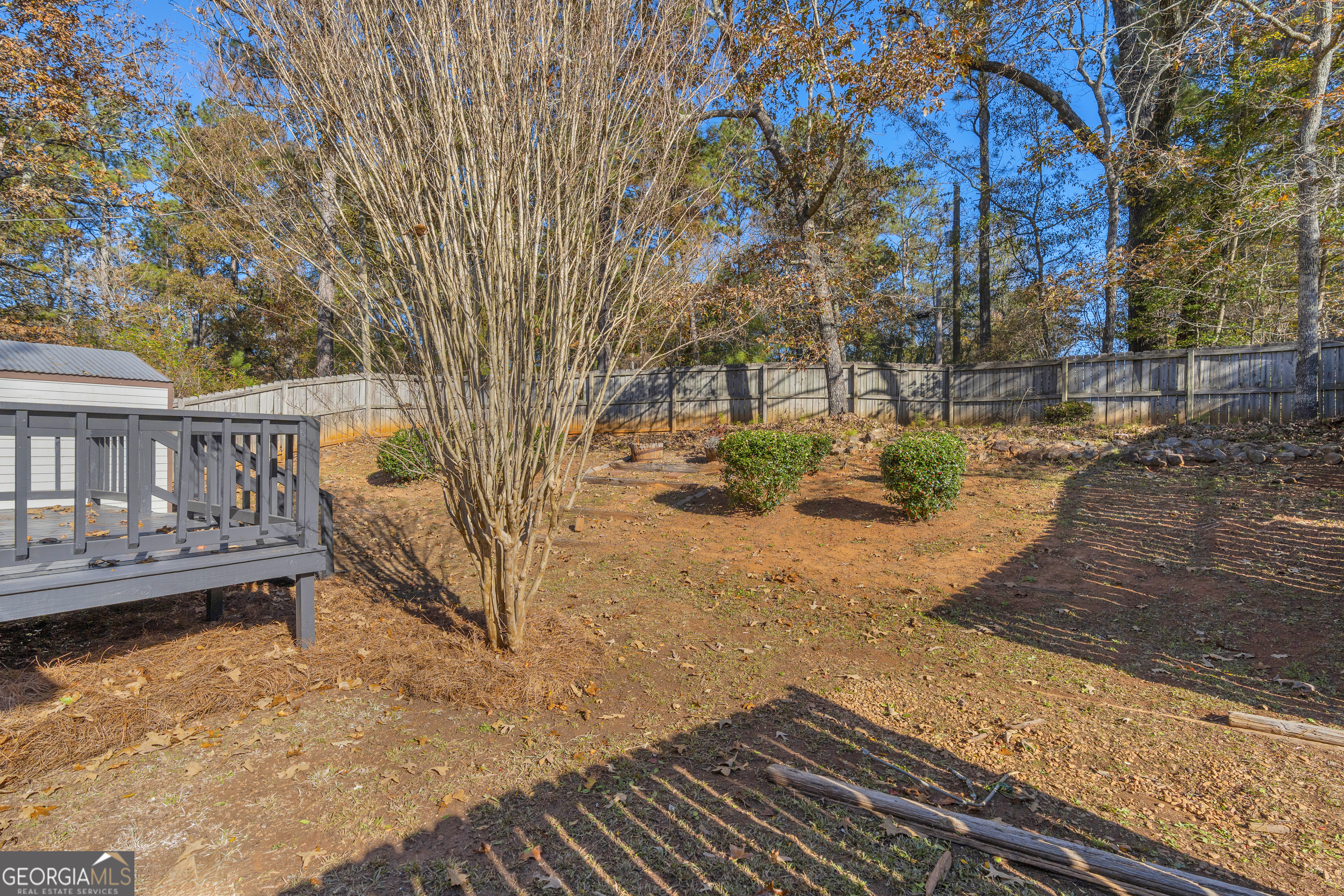 395 Barnetts Bridge Road Jackson, GA 30233 - Photo 59 of 82 a view of a yard with wooden fence