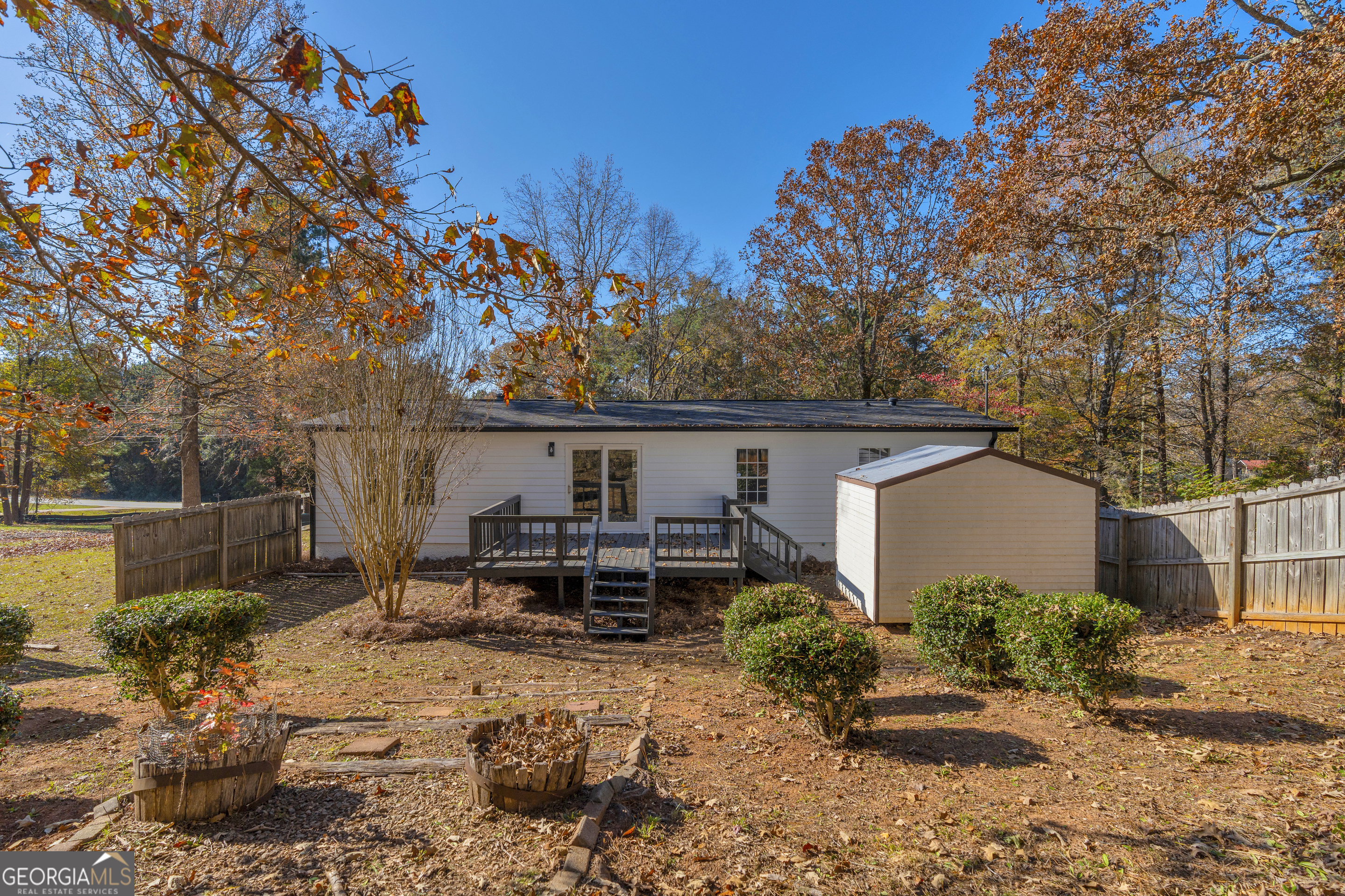395 Barnetts Bridge Road Jackson, GA 30233 - Photo 62 of 82 a front view of a house with garden
