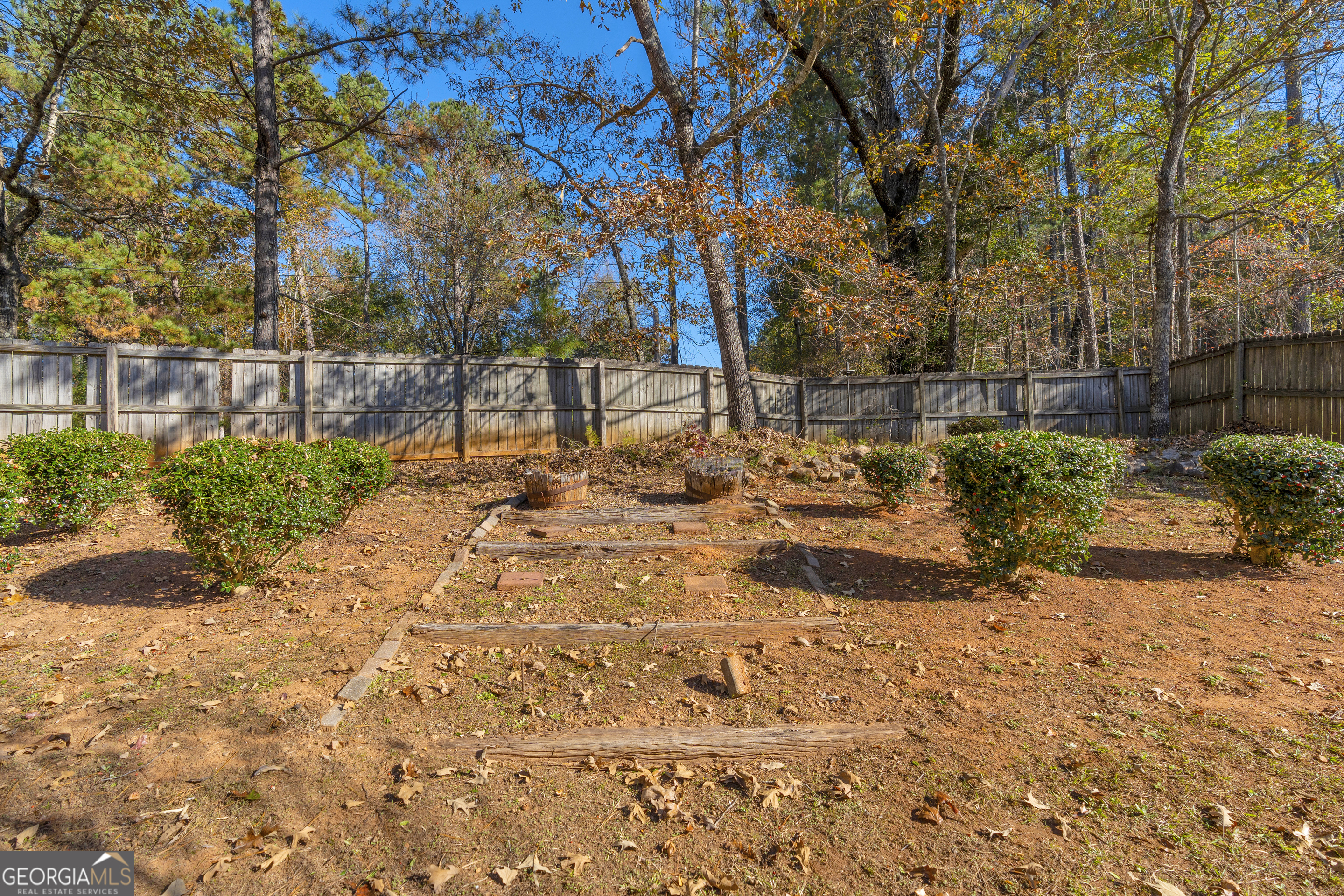 395 Barnetts Bridge Road Jackson, GA 30233 - Photo 63 of 82 a view of a yard covered with snow on the road