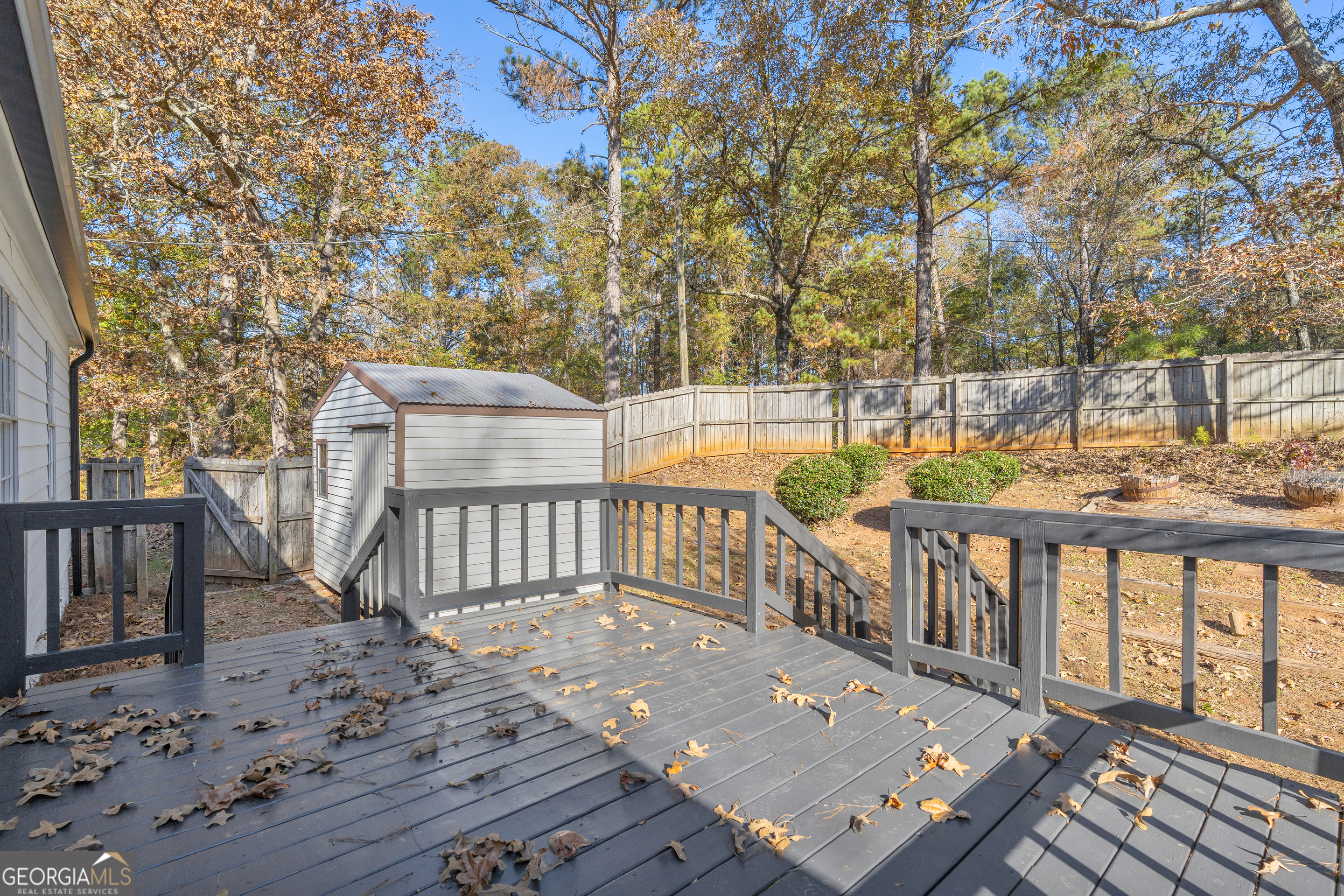 395 Barnetts Bridge Road Jackson, GA 30233 - Photo 66 of 82 a view of a roof deck with wooden floor and fence