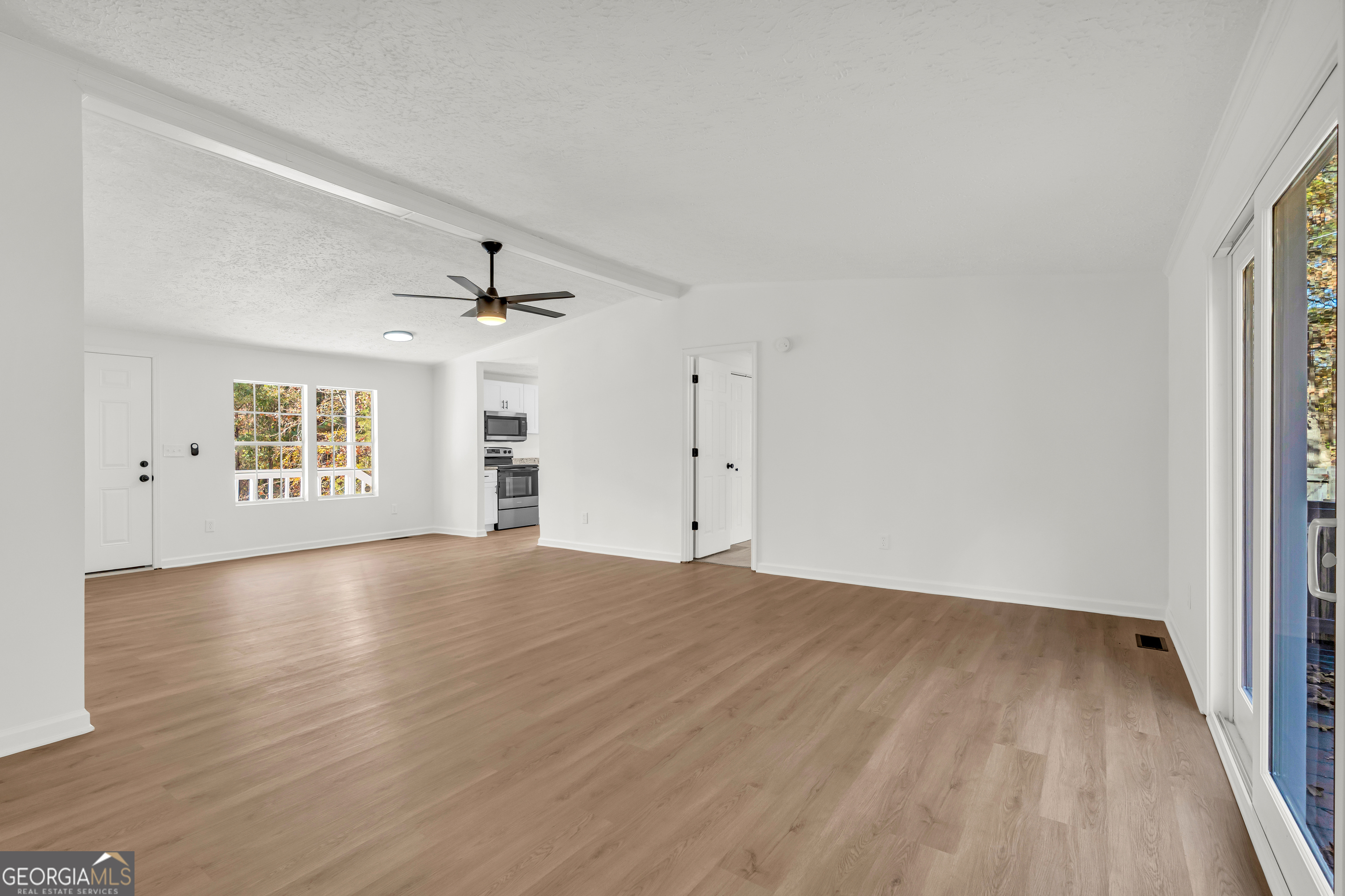 395 Barnetts Bridge Road Jackson, GA 30233 - Photo 7 of 82 wooden floor in an empty room with a window