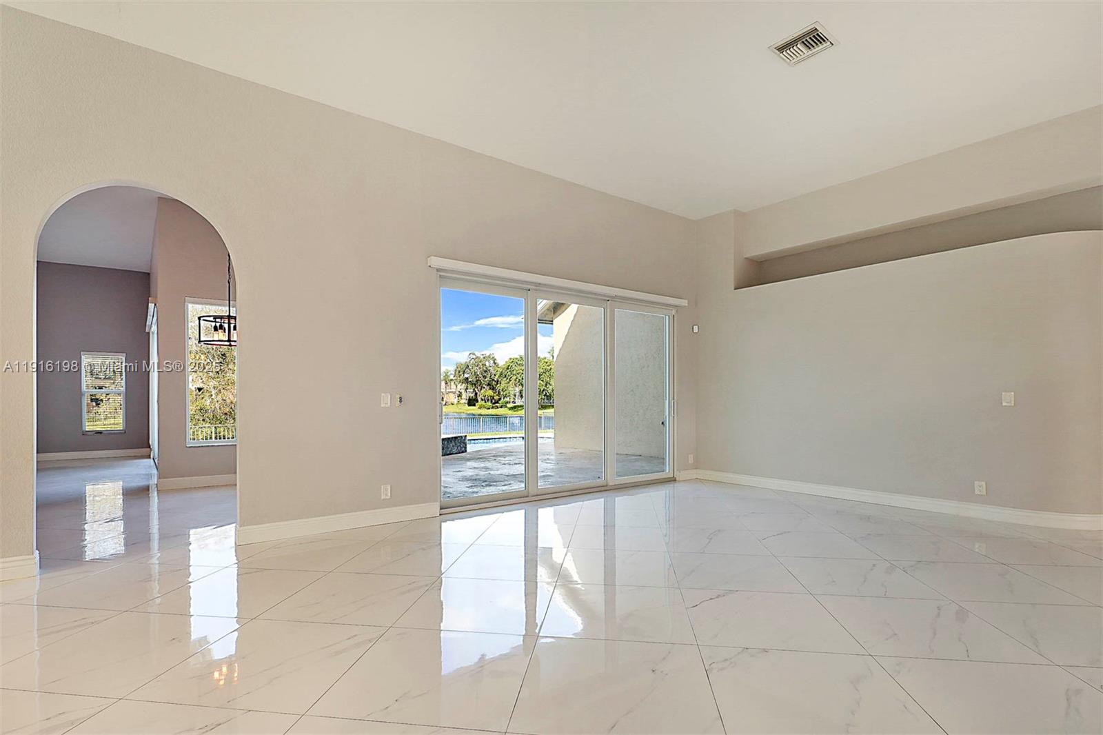 10133 Northwest 48th Drive Coral Springs, FL 33076 - Photo 13 of 49 a view of an empty room with a window