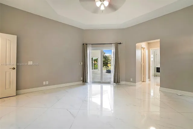 a spacious bathroom with a tub sink shower and mirror