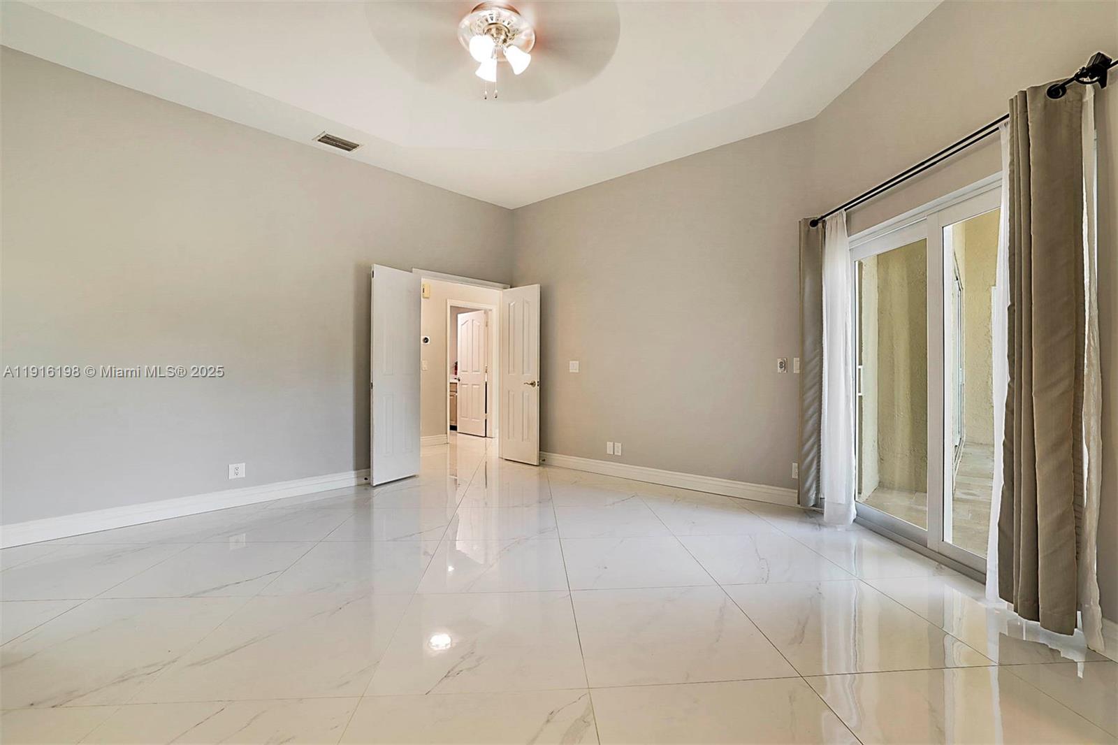 10133 Northwest 48th Drive Coral Springs, FL 33076 - Photo 25 of 49 an empty room with a natural light