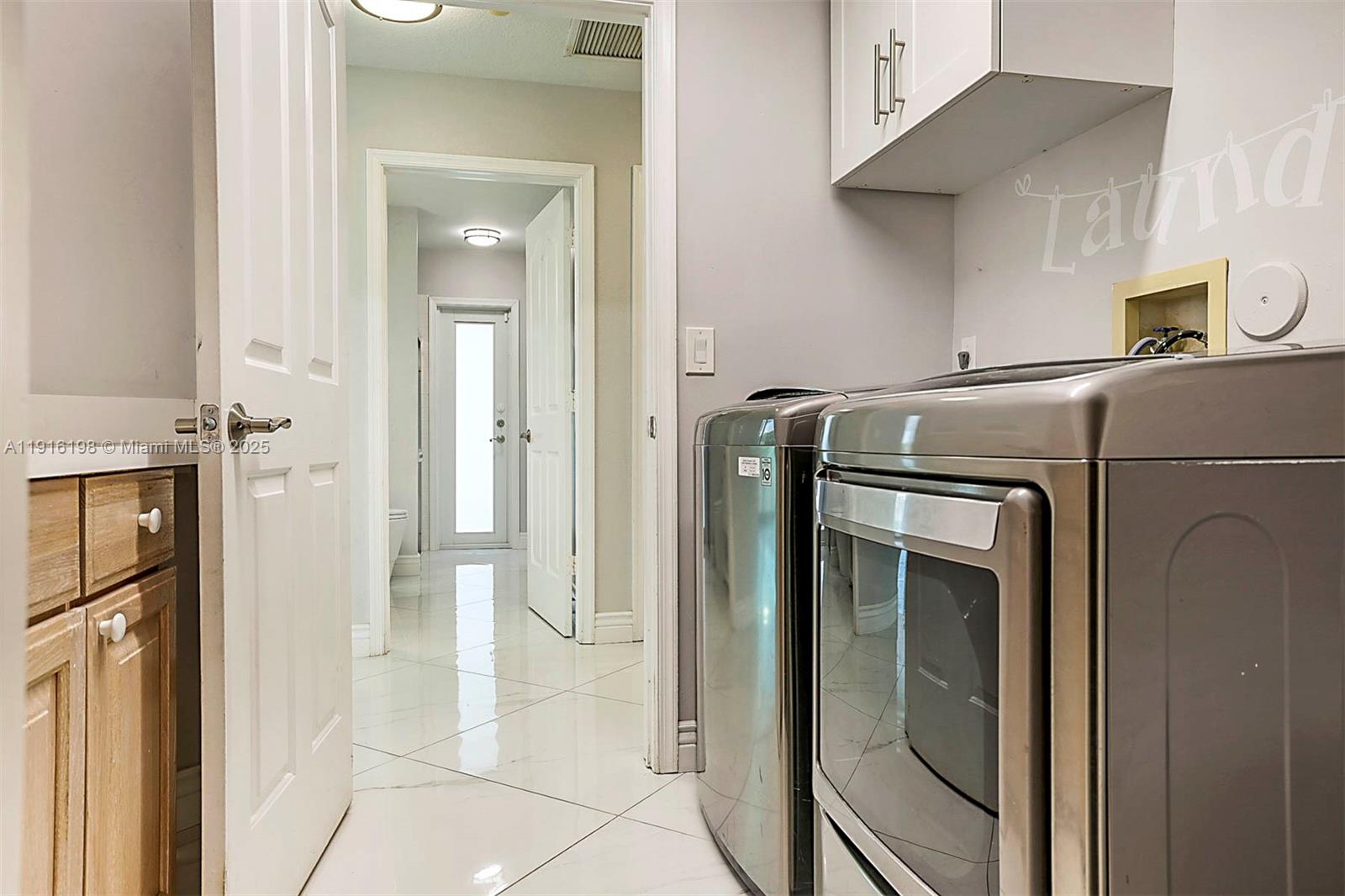 10133 Northwest 48th Drive Coral Springs, FL 33076 - Photo 35 of 49 a utility room with dryer and washer