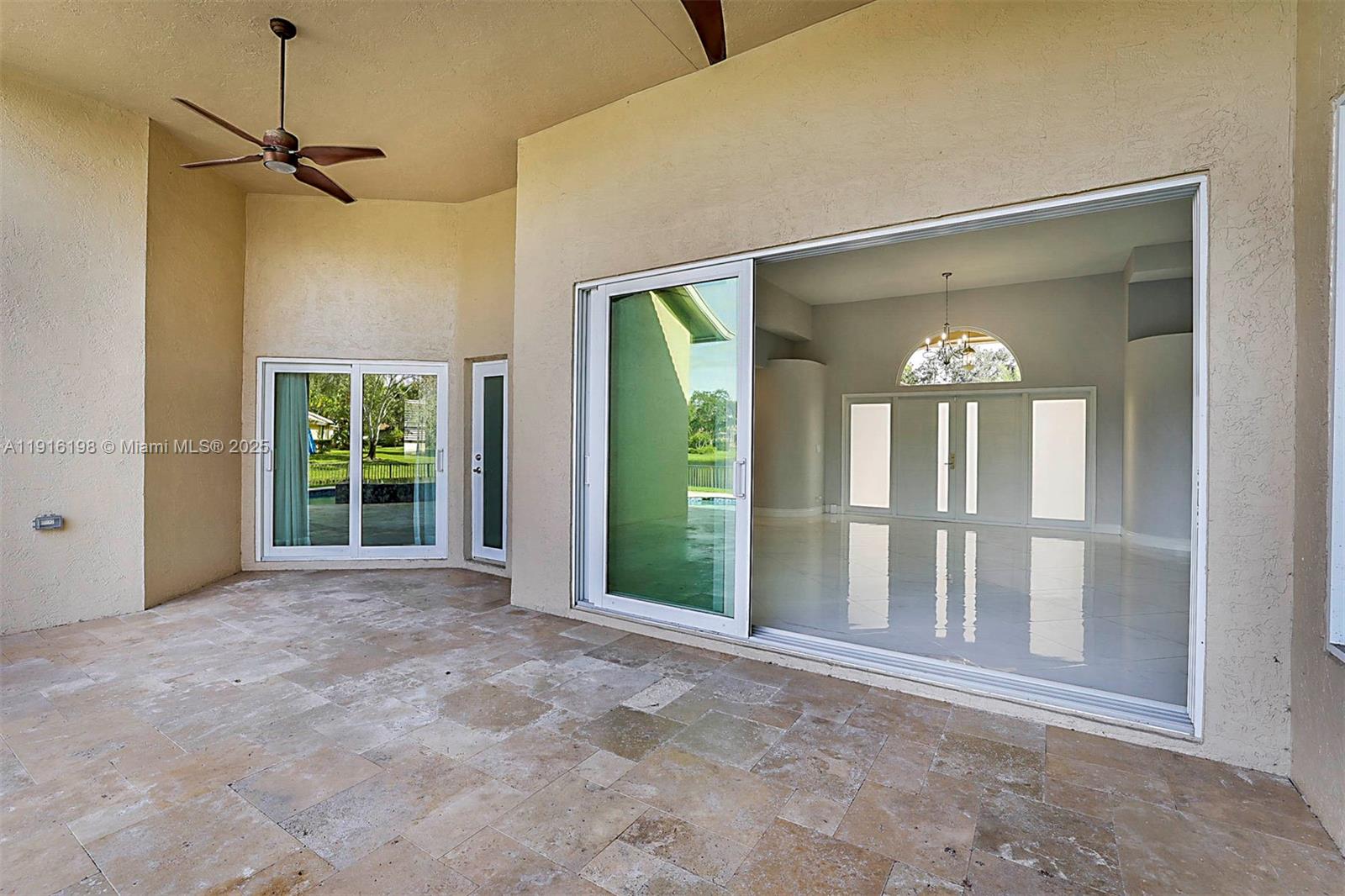 10133 Northwest 48th Drive Coral Springs, FL 33076 - Photo 39 of 49 a view of a big room with windows and chandelier