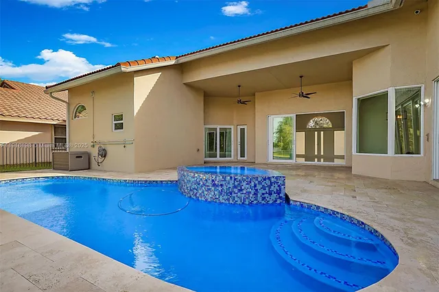 a swimming pool with lake view