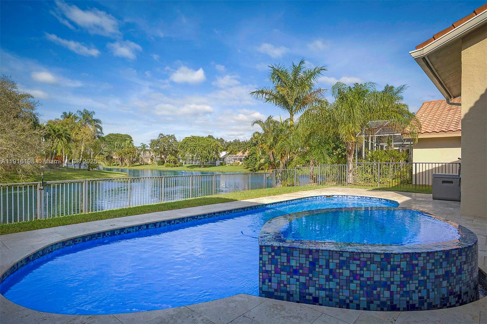 10133 Northwest 48th Drive Coral Springs, FL 33076 - Photo 43 of 49 a swimming pool with lake view