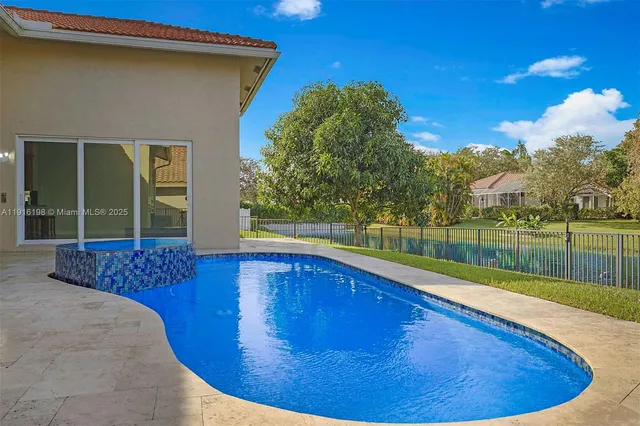 a view of a swimming pool with a patio