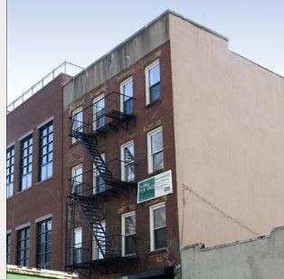 a front view of a building with a lot of windows