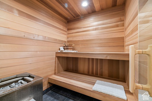 917 West Deep Forest Road Coalville, UT 84017 - Photo 27 of 41 Wood-paneled sauna featuring built-in bench seating, recessed lighting, and a metal sauna heater with stones
