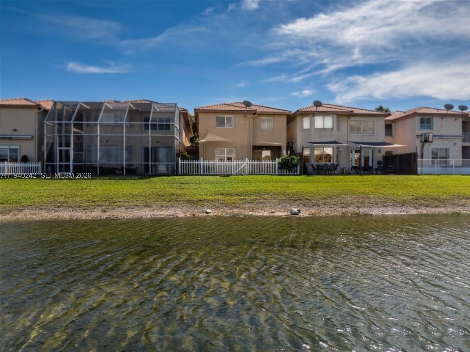 11541 Northwest 68th Terrace Doral, FL 33178 - Photo 17 of 18 view of the property from the lake, Doral