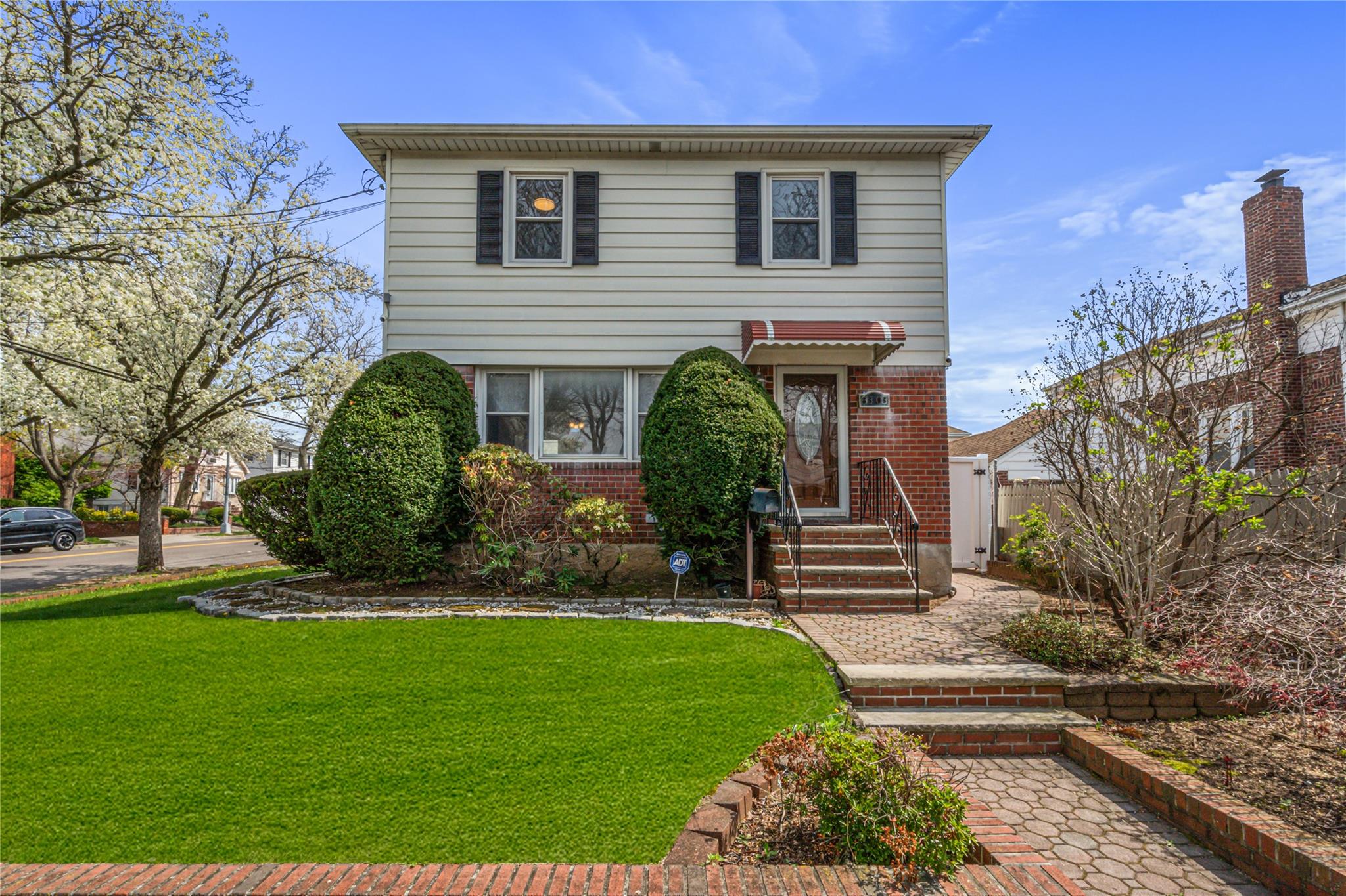 83-03 258th Street Queens, NY 11004 - Photo 1 of 1 a front view of a house with a garden