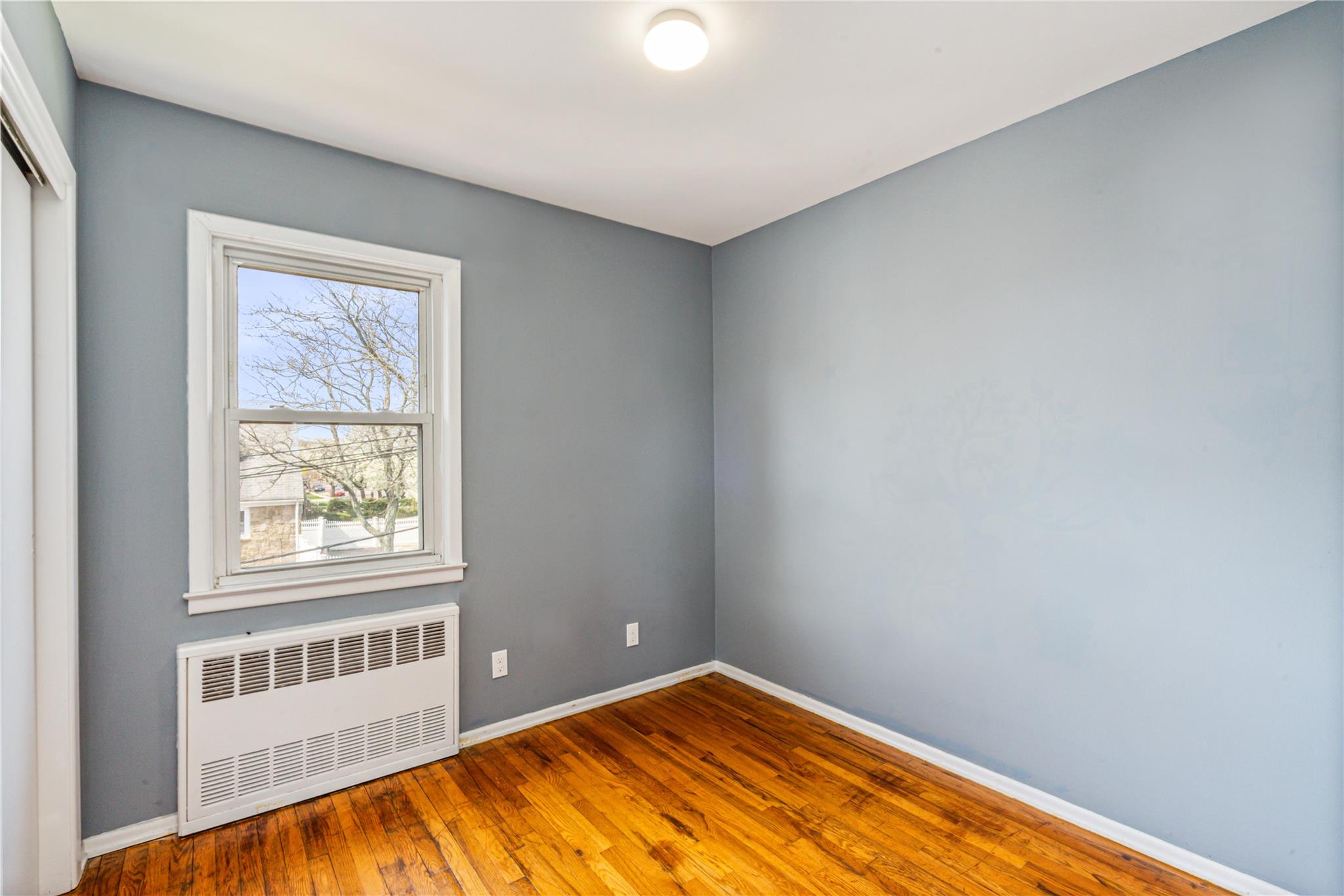 83-03 258th Street Queens, NY 11004 - Photo 12 of 20 a view of an empty room with a window