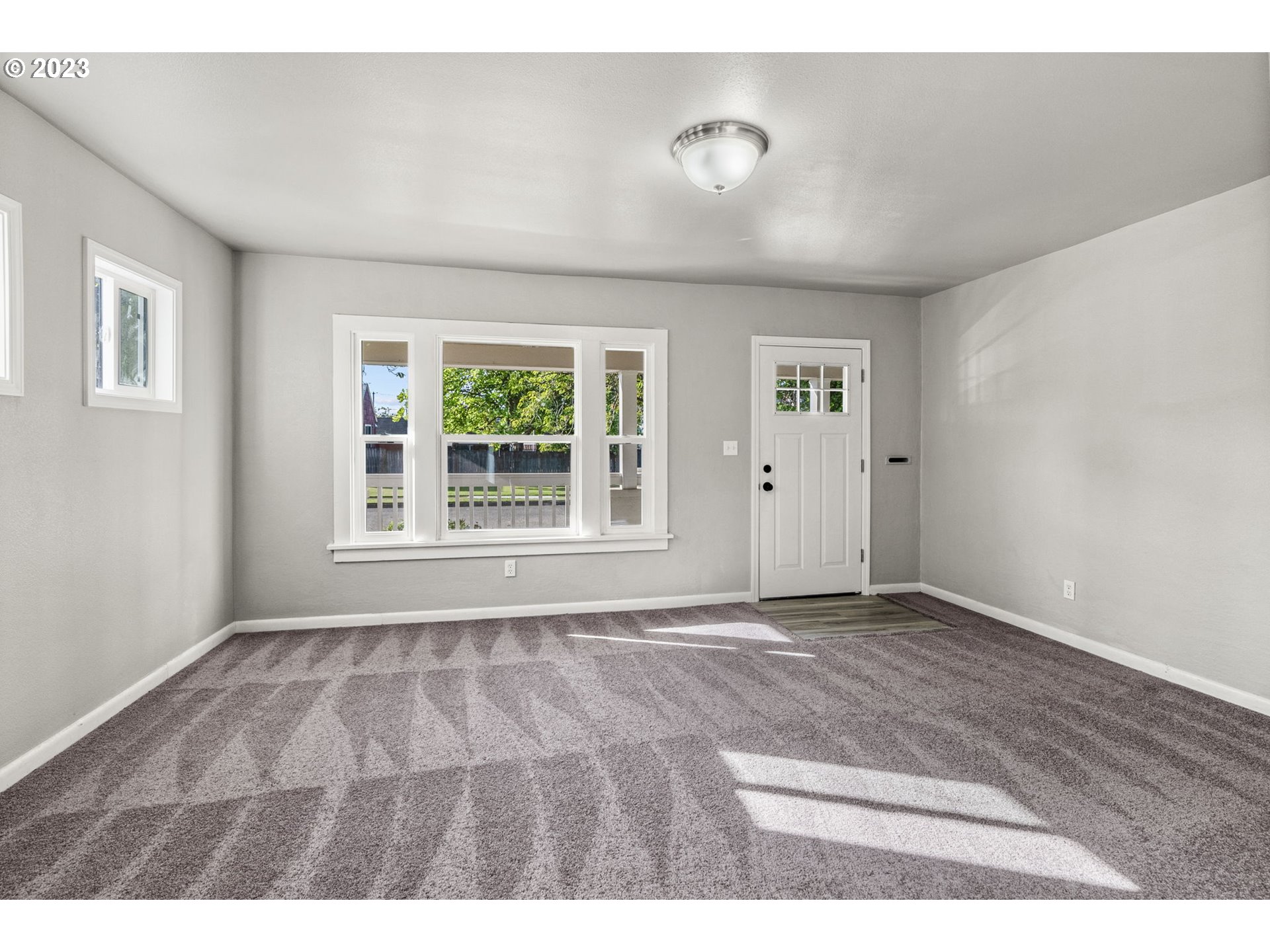 2808 Florida Street Longview, WA 98632 - Photo 3 of 20 a view of an empty room with a window