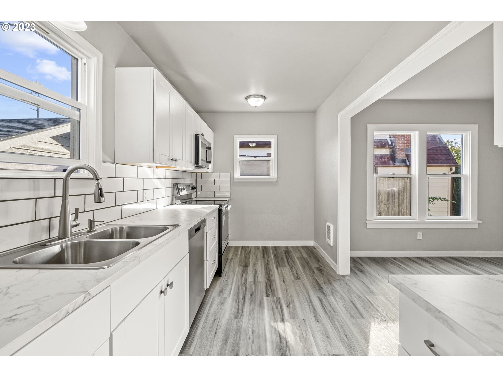 2808 Florida Street Longview, WA 98632 - Photo 6 of 20 a kitchen with a sink cabinets and window