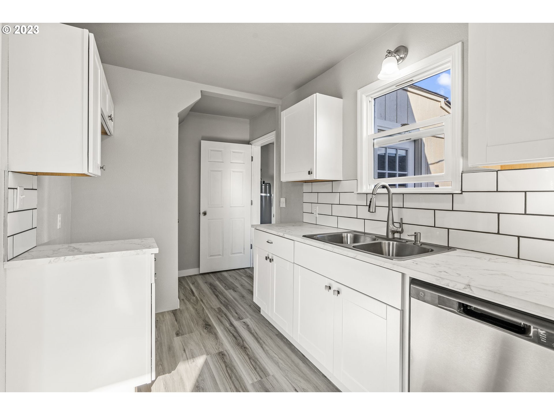 2808 Florida Street Longview, WA 98632 - Photo 8 of 20 a kitchen with a sink a stove and cabinets